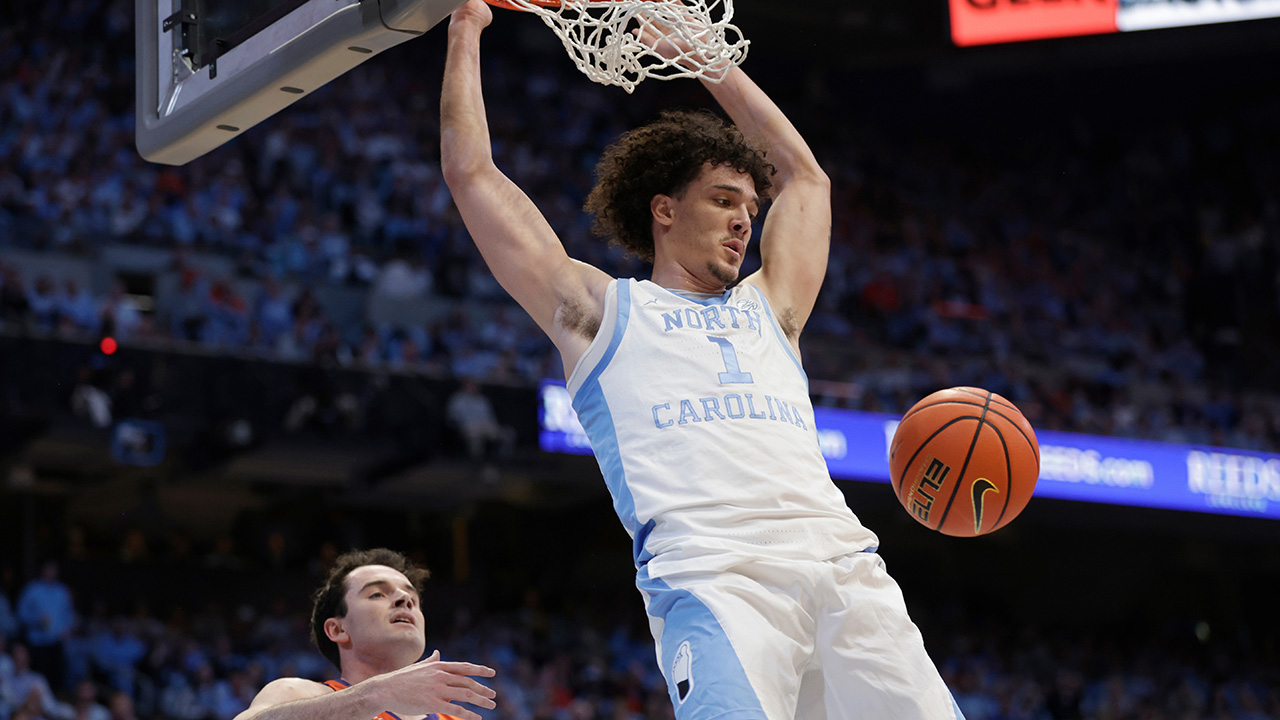 UNC forward Zayden High dunks as Clemson forward Nick Davidson can only watch Tuesday in Chapel Hill.