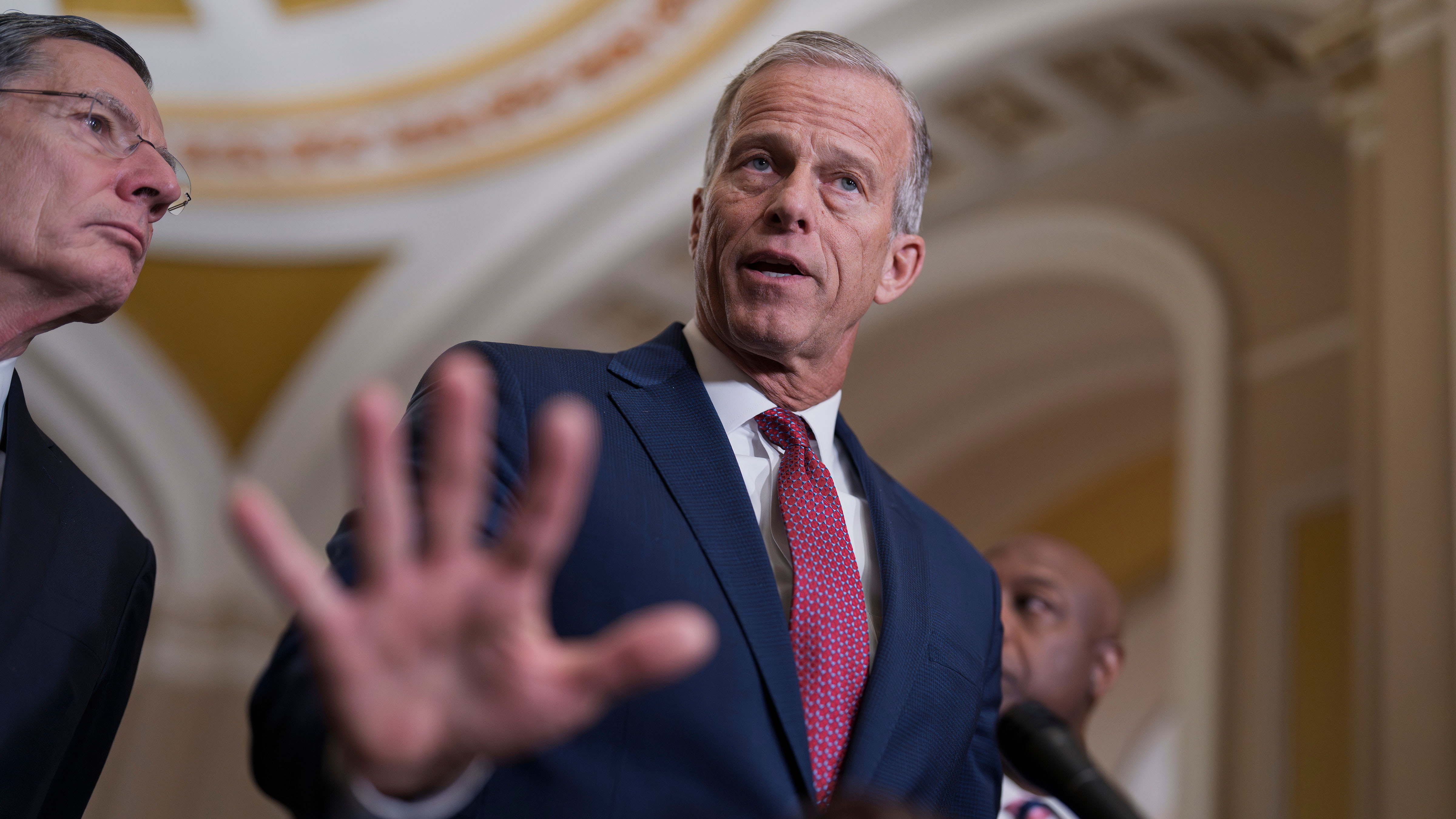 Senate Majority Leader John Thune, R-S.D., center, joined at left by Sen. John Barrasso, R-Wyo., the GOP whip, speaks to reporters at the Capitol in Washington, Tuesday, March 3, 2026. 