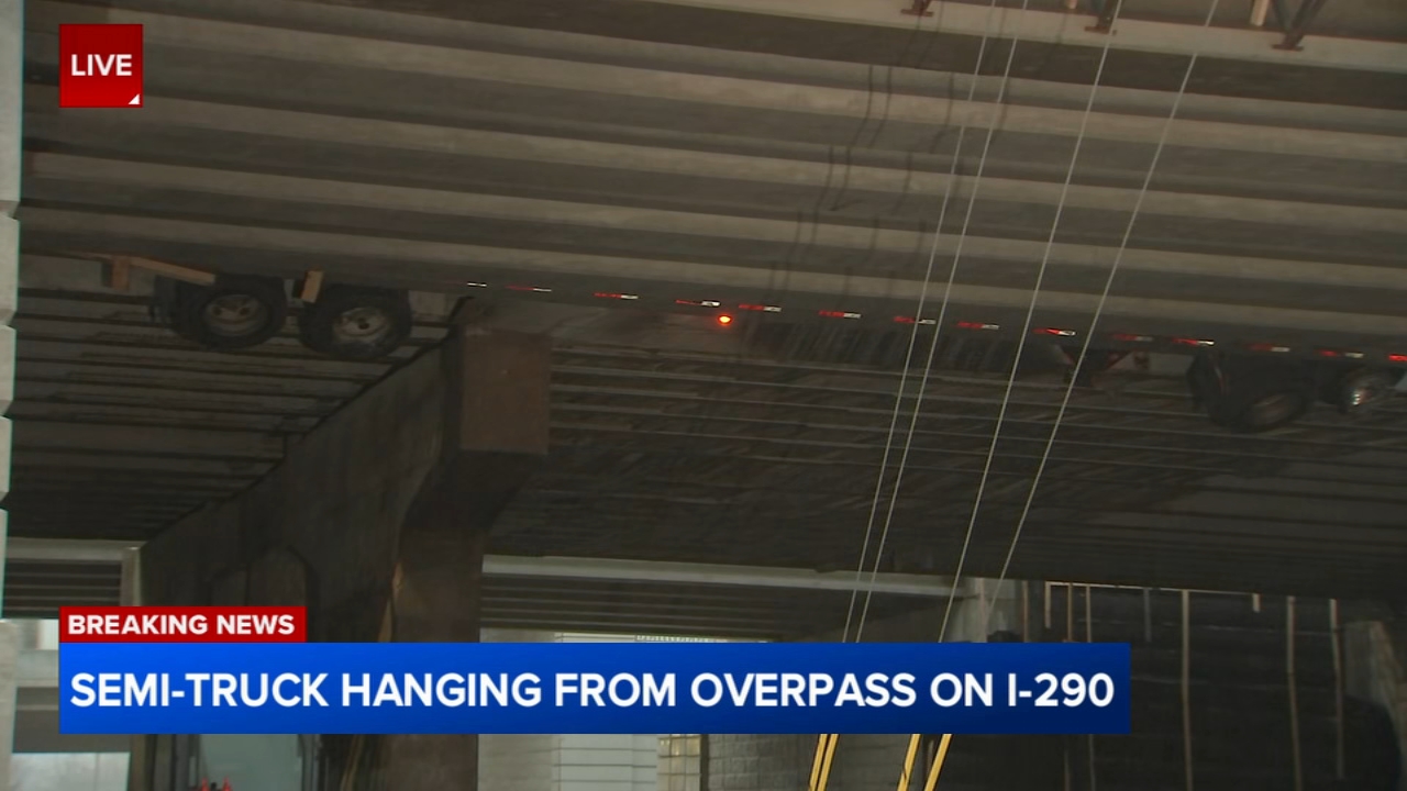 Semi-truck hangs over I-290 overpass