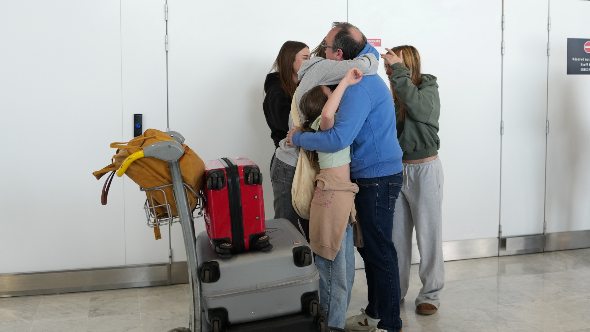 People arrive from Dubai at the Charles de Gaulle international Airport in Roissy, outside Paris, France, Thursday, March 5, 2026.