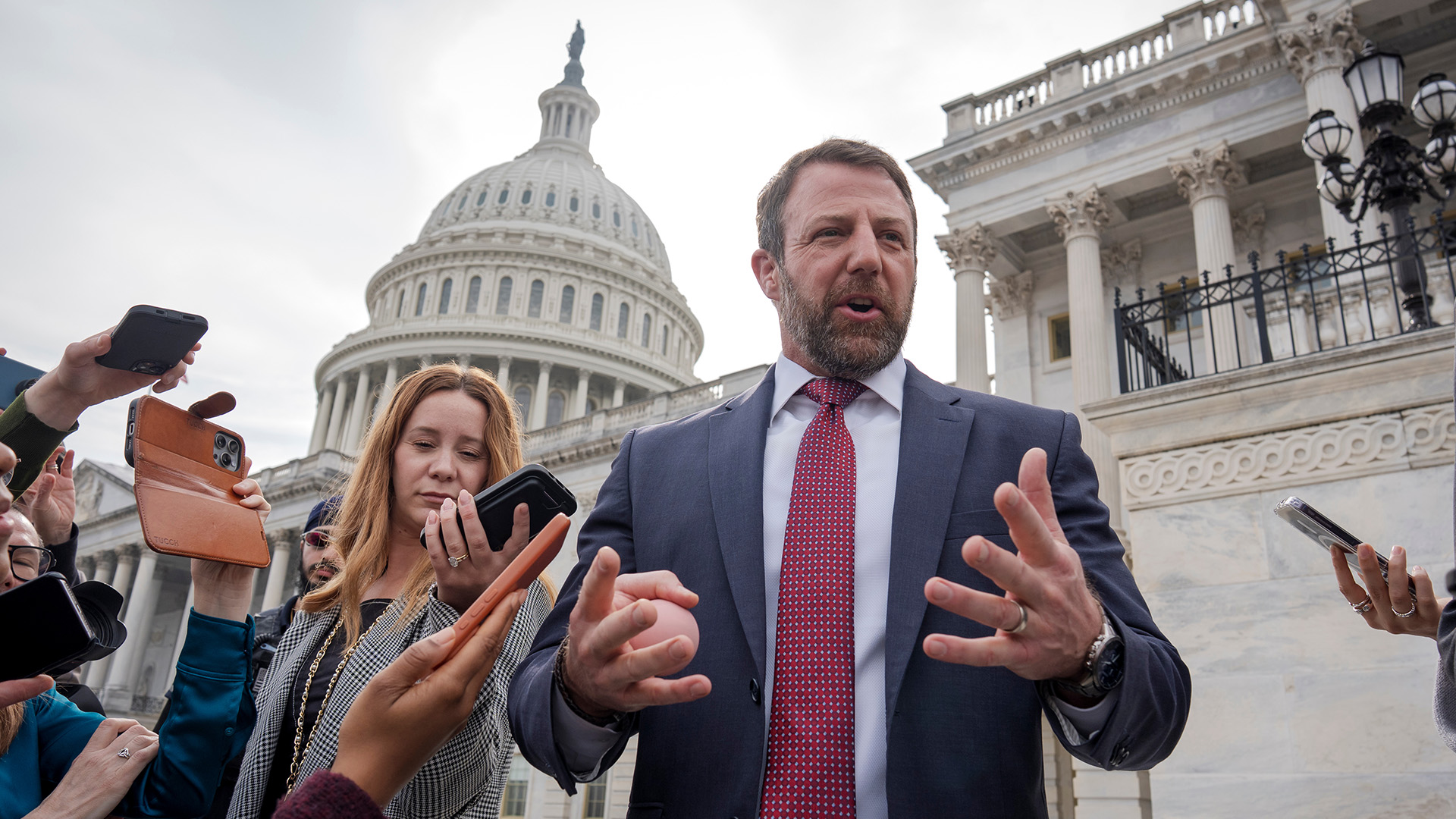 Sen. Markwayne Mullin, R-Okla., speaks with reporters on the steps at the Capitol in Washington, Thursday, March 5, 2026.