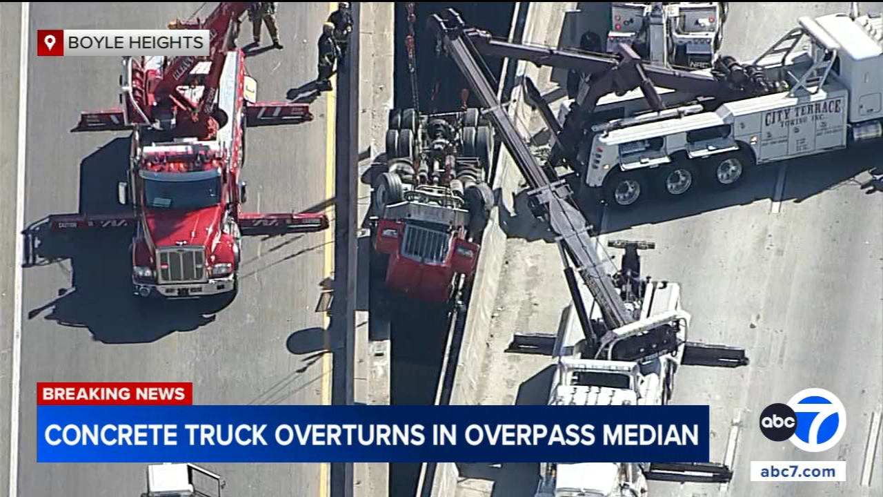 Concrete truck overturns on transition road in Boyle Heights, dangles above 10 Freeway