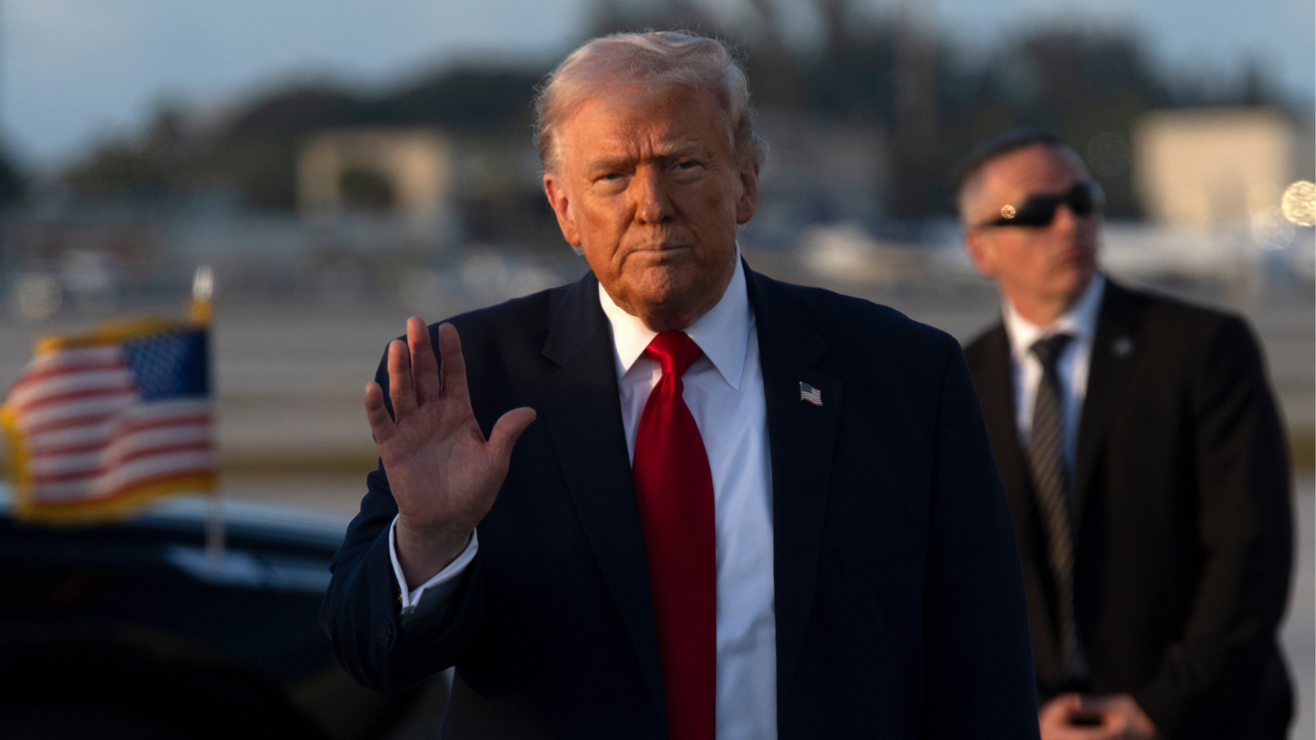 President Donald Trump gestures after stepping off Air Force One, Saturday, March 7, 2026, at Miami International Airport in Miami.