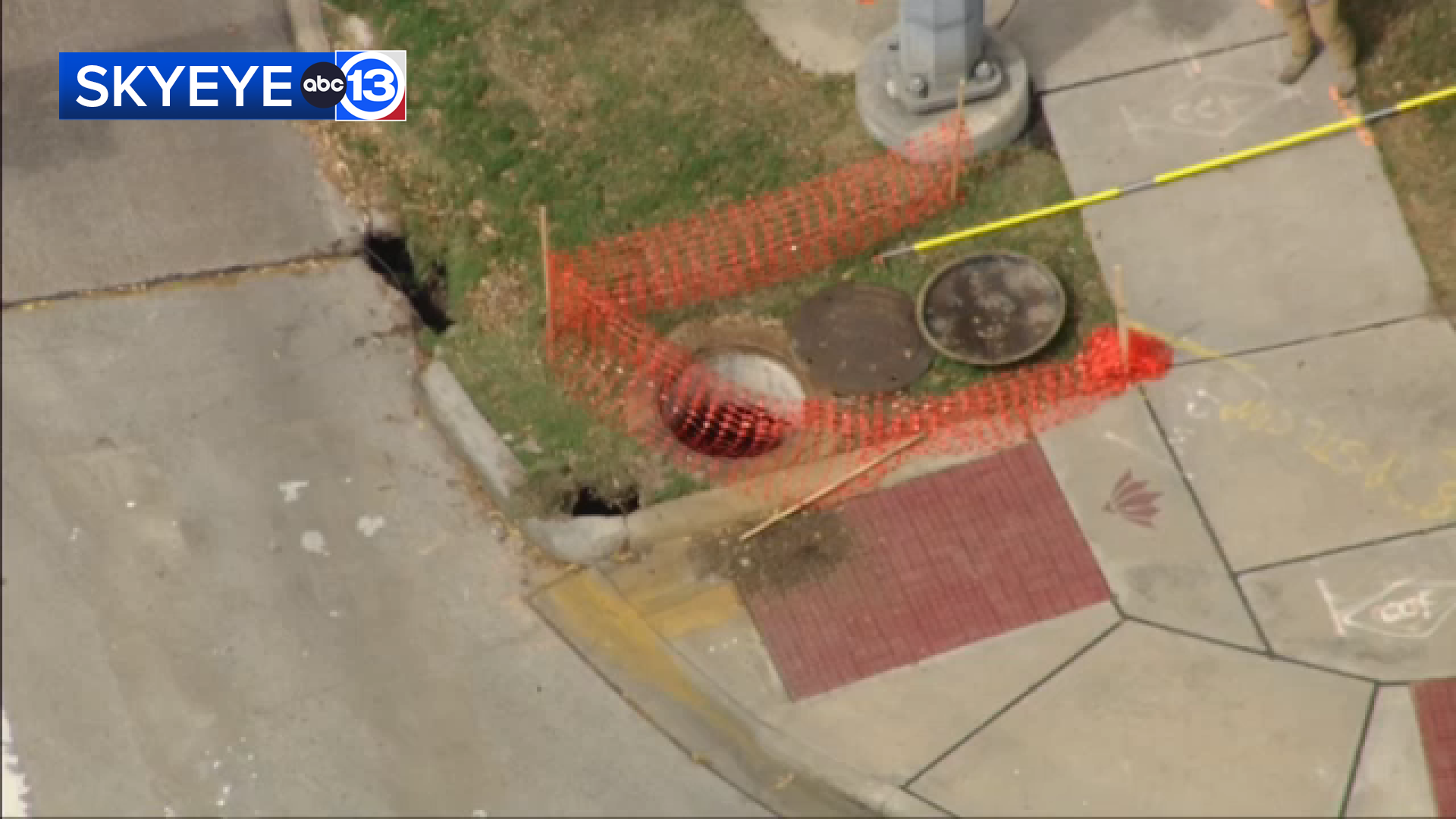 SkyEye was over the scene, and images showed two holes on the ground between the roadway and the sidewalk.