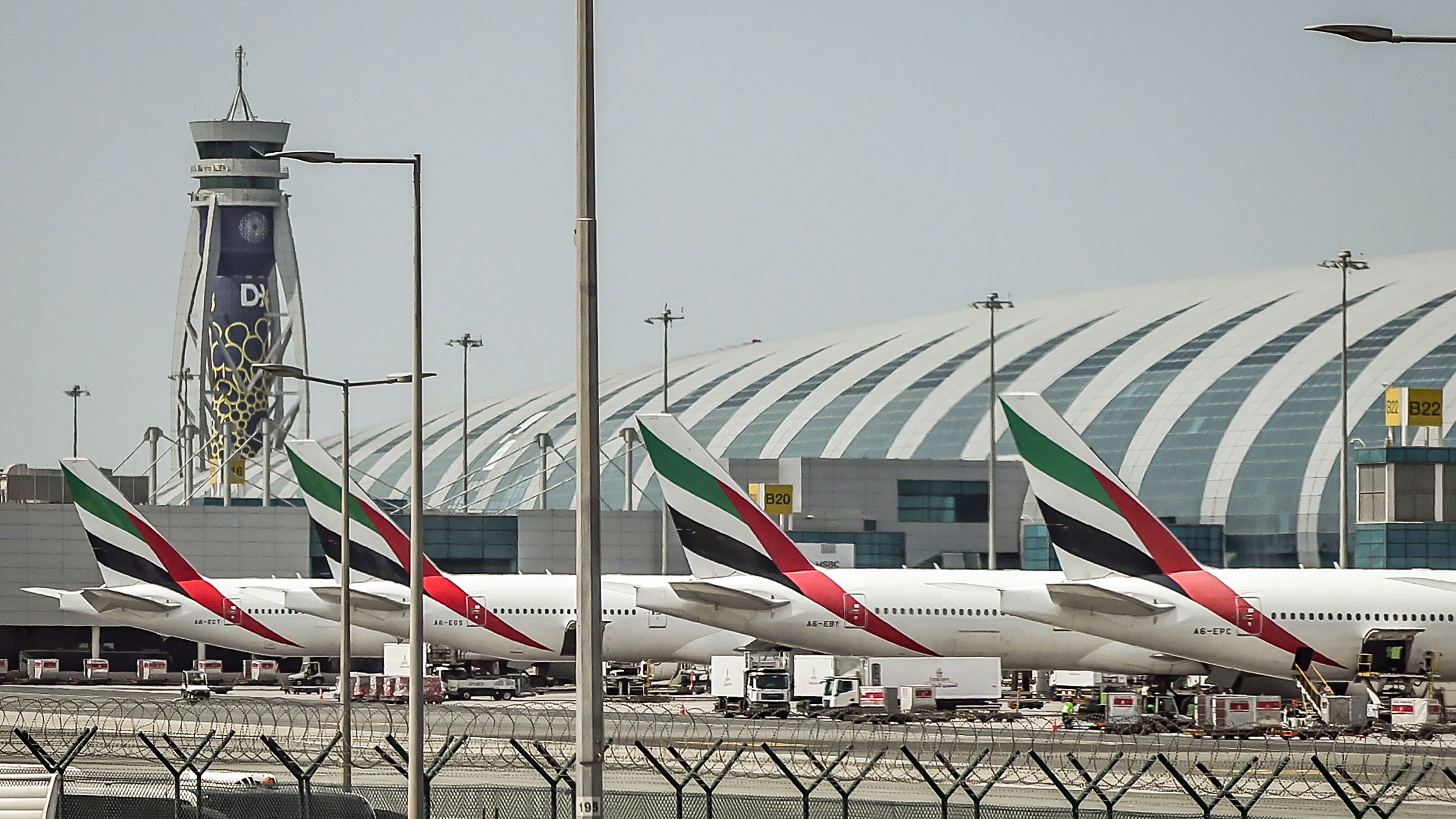 Passenger planes sit on the tarmac at Dubai International Airport in Dubai on March 11, 2026.