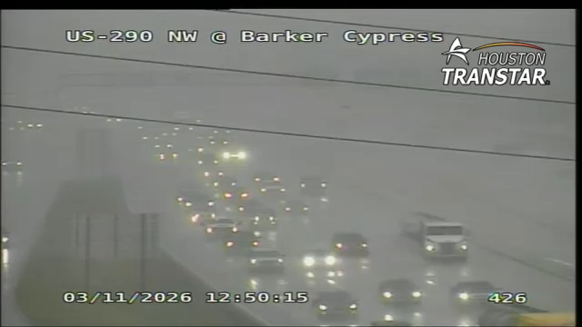 Houston TranStar camera shows rainy conditions on Highway 290 and Barker Cypress Road.