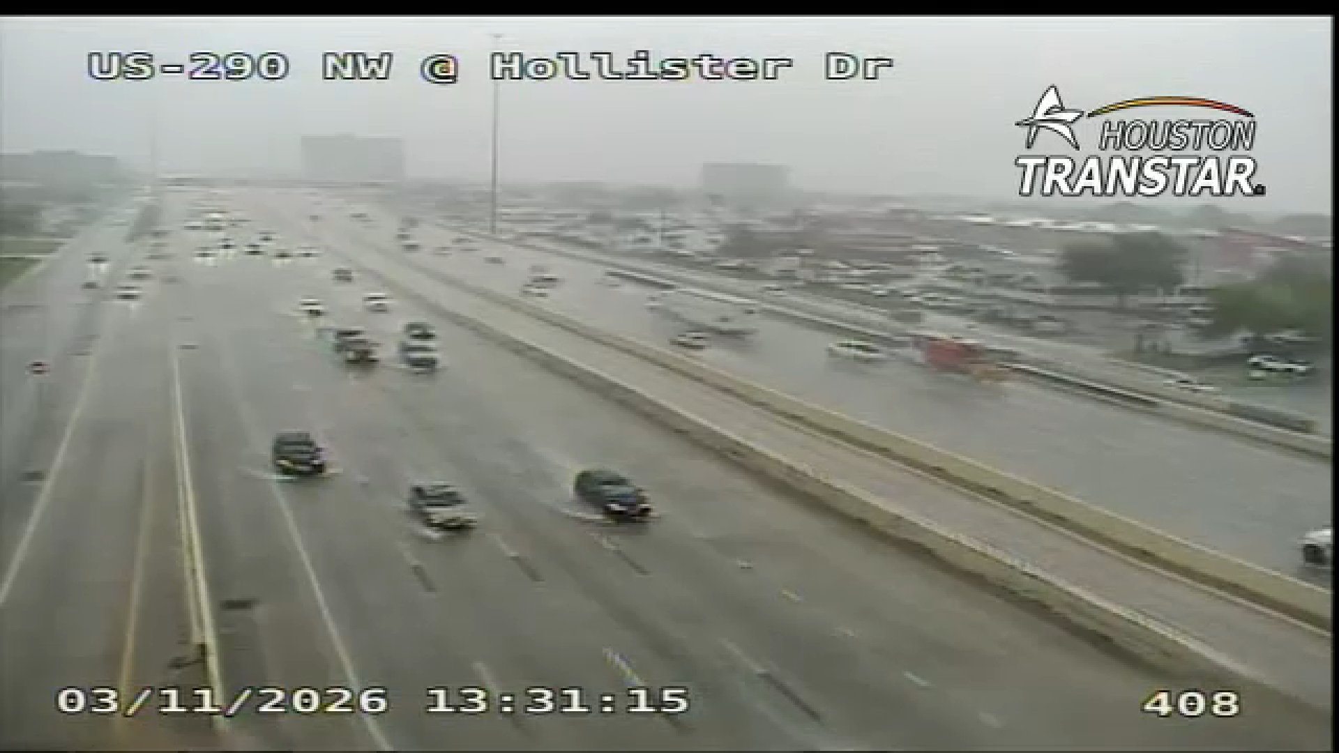 Houston TranStar camera shows rainy conditions on Highway 290 and Hollister Drive.