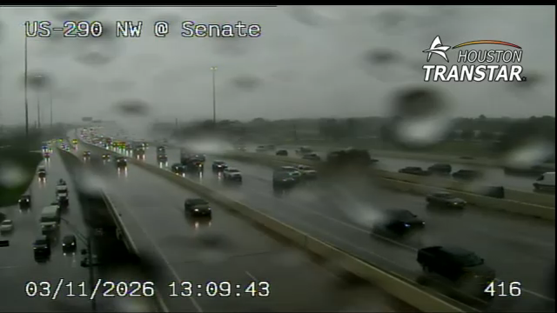 Houston TranStar camera shows rainy conditions on Highway 290 and Senate Avenue.