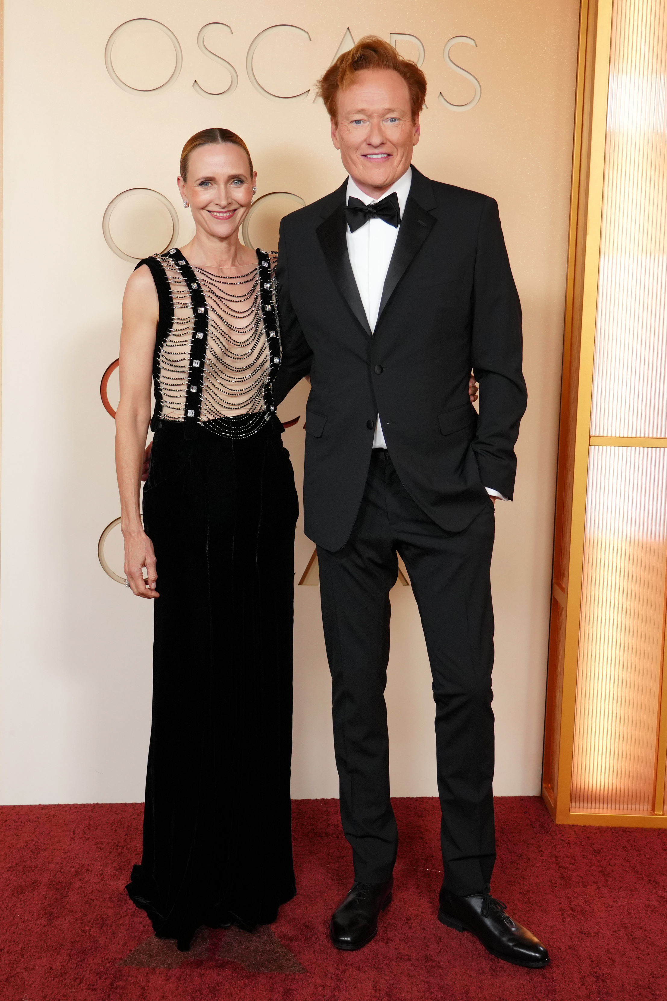 Liza Powel O'Brien, left, and Conan O'Brien arrive at the Oscars on Sunday, March 15, 2026, at the Dolby Theatre in Los Angeles.
