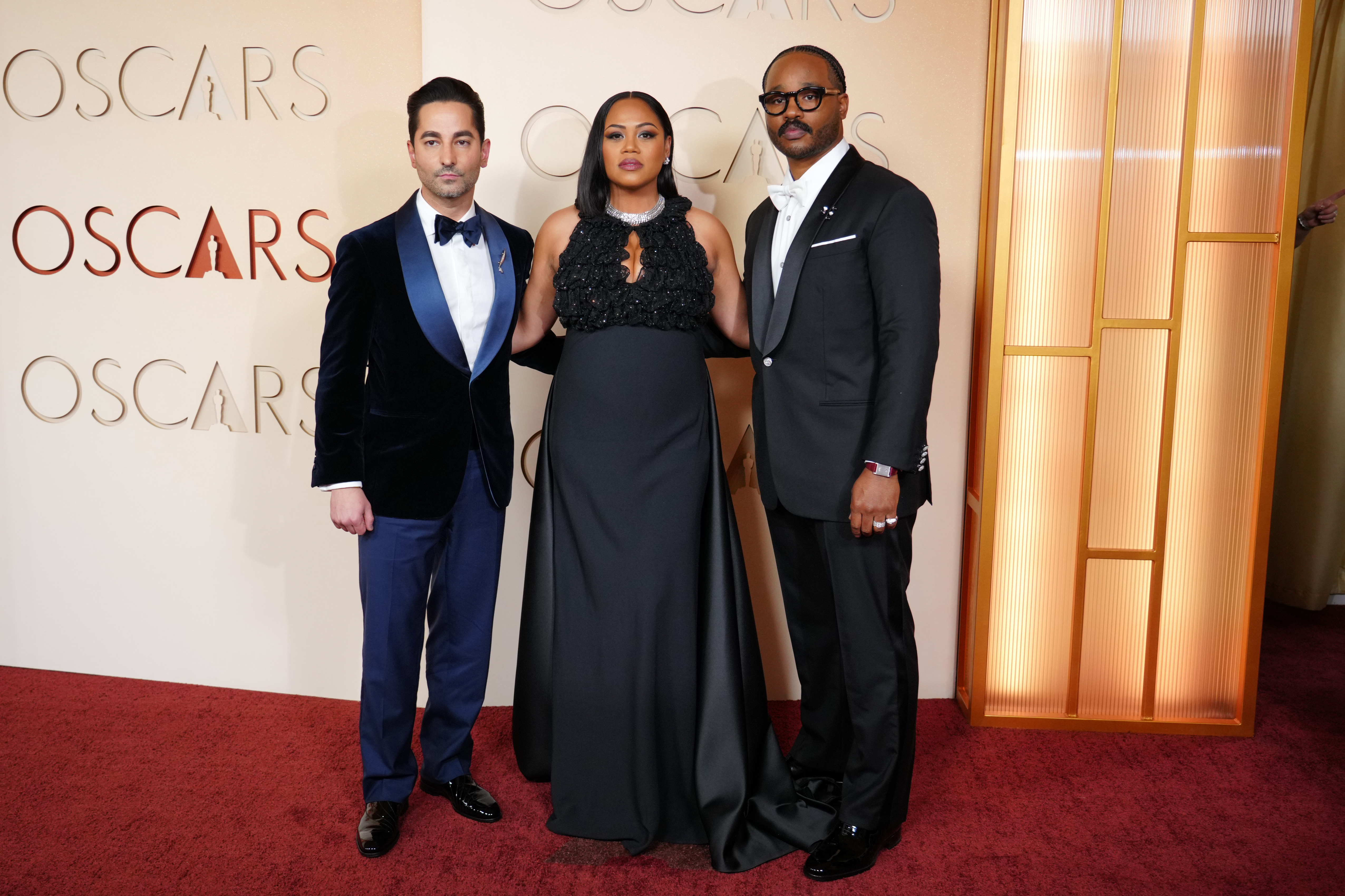 Sev Ohanian,from left, Zinzi Evans, and Ryan Coogler arrive at the Oscars on Sunday, March 15, 2026, at the Dolby Theatre in Los Angeles.