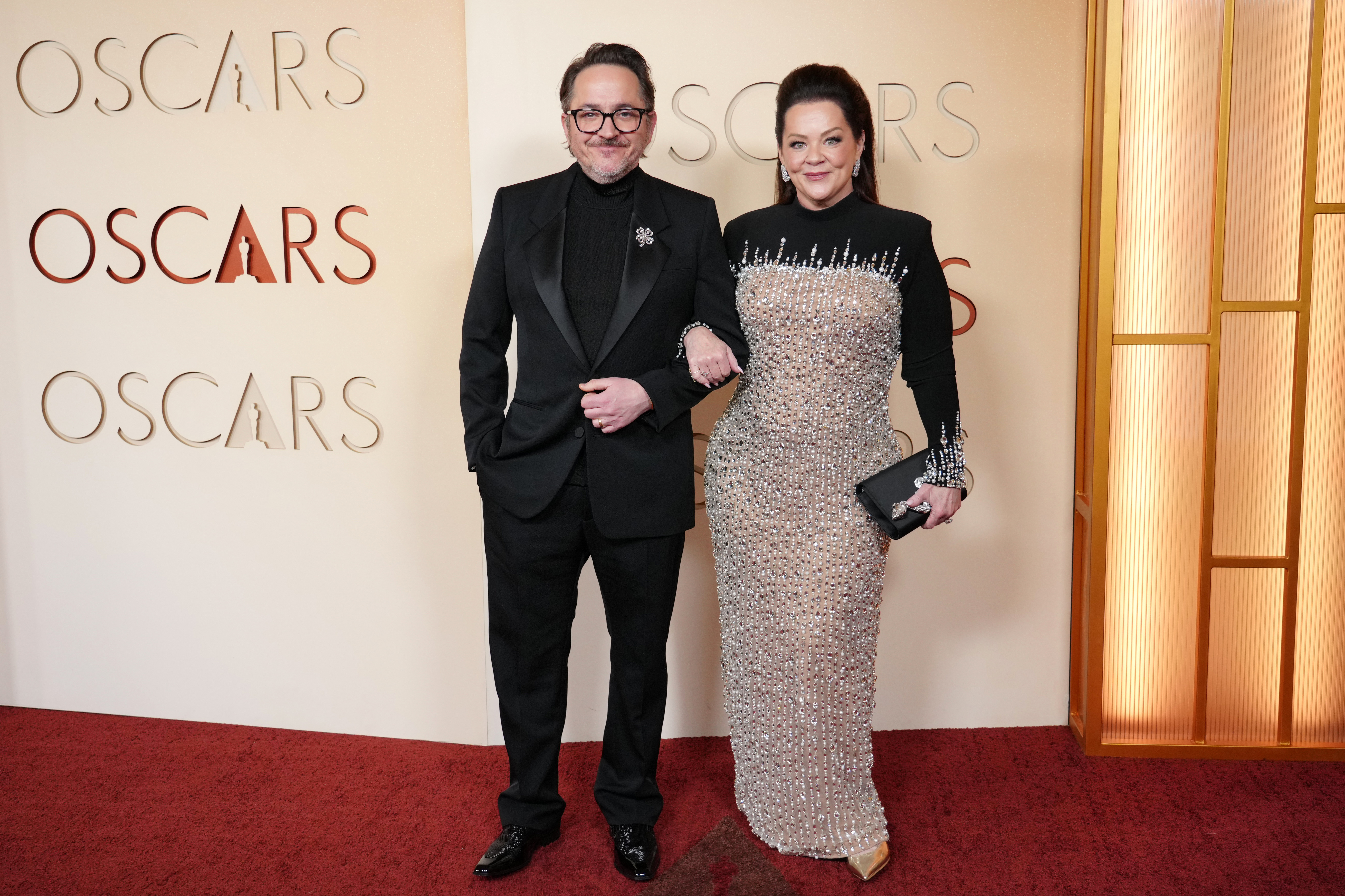 Ben Falcone, left, and Melissa McCarthy arrive at the Oscars on Sunday, March 15, 2026, at the Dolby Theatre in Los Angeles.