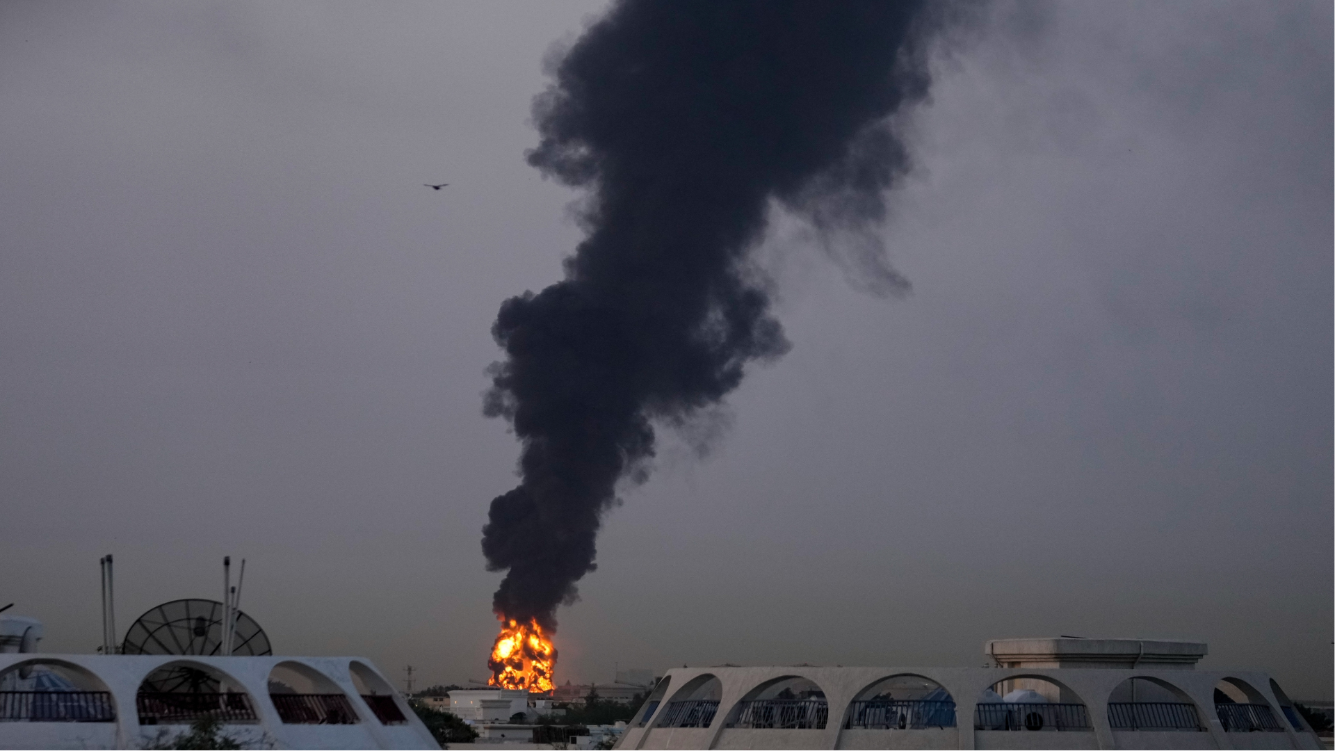 Plumes of smoke rise after a drone struck a fuel tank forcing the temporary suspension of flights near Dubai International Airport, in United Arab Emirates, Monday, March 16, 2026.