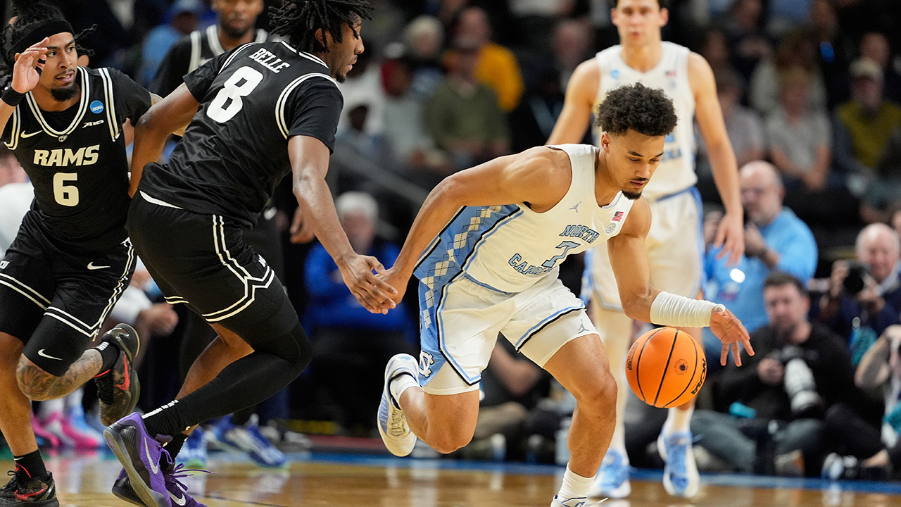 North Carolina's Seth Trimble battles for the ball with VCU guard Terrence Hill Jr. on Thursday at the NCAA tournament in Greenville, South Carolina.