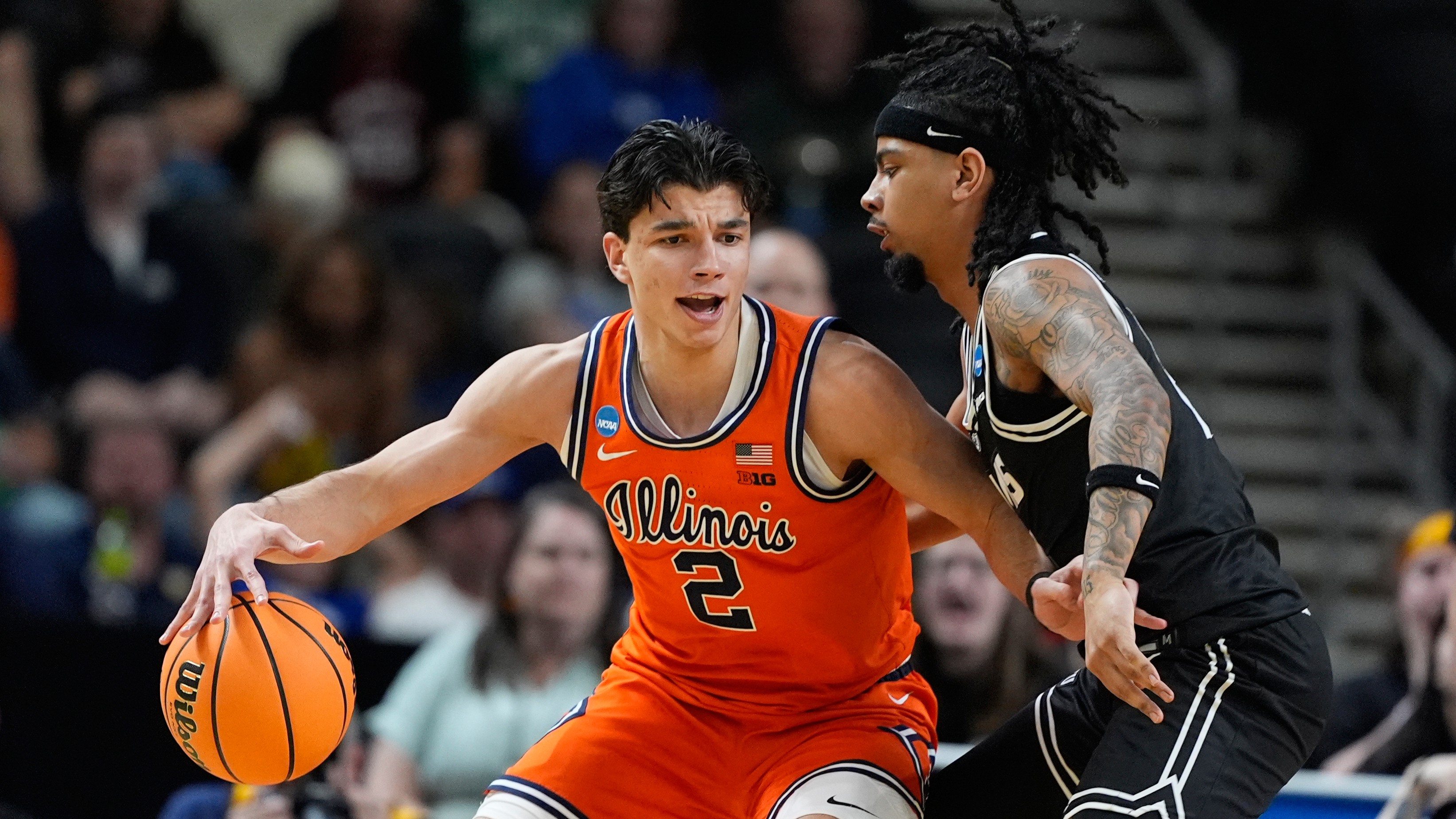 Illinois guard Andrej Stojakovic dribbles against VCU guard Terrence Hill Jr. during the second round of the NCAA college basketball tournament, March 21, 2026, in Greenville, S.C.