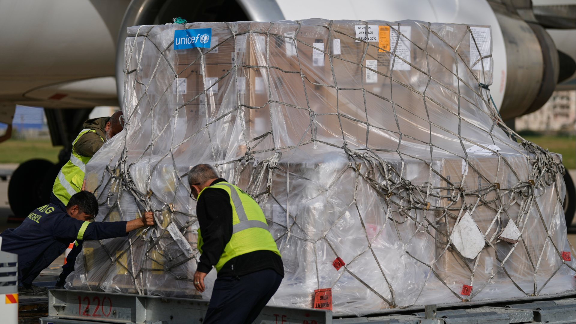Workers unload medical aid donated by UNICEF and the World Health Organization for displaced people at Rafik Hariri International Airport in Beirut, Lebanon, March 18, 2026.