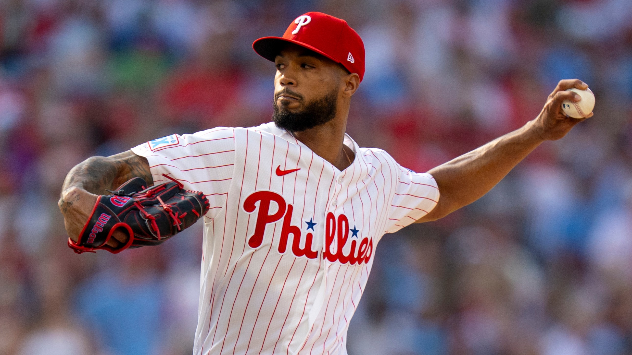 Philadelphia Phillies stating pitcher Cristopher Sanchez delvers during the first inning of an opening-day baseball game against the Texas Rangers.