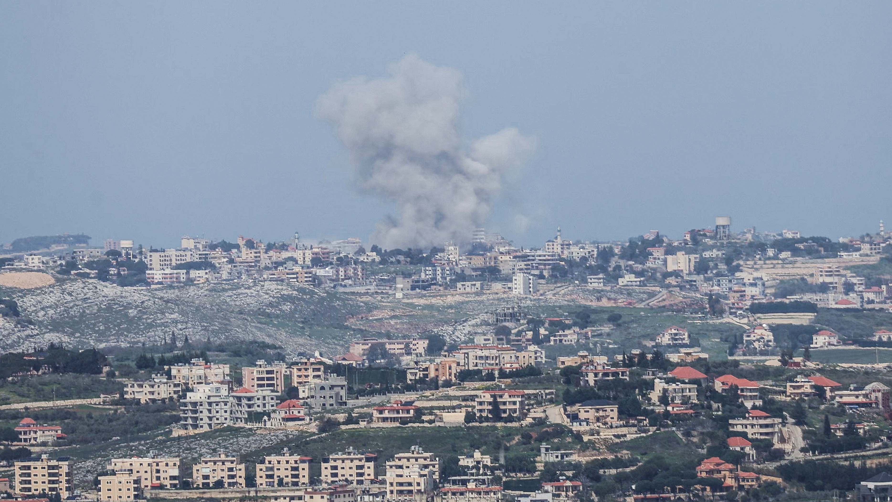 A photo taken from the southern Lebanese area of Marjayoun shows smoke rising from the site of an Israeli airstrike that targeted the village of Deir al-Zahrani on March 28, 2026.