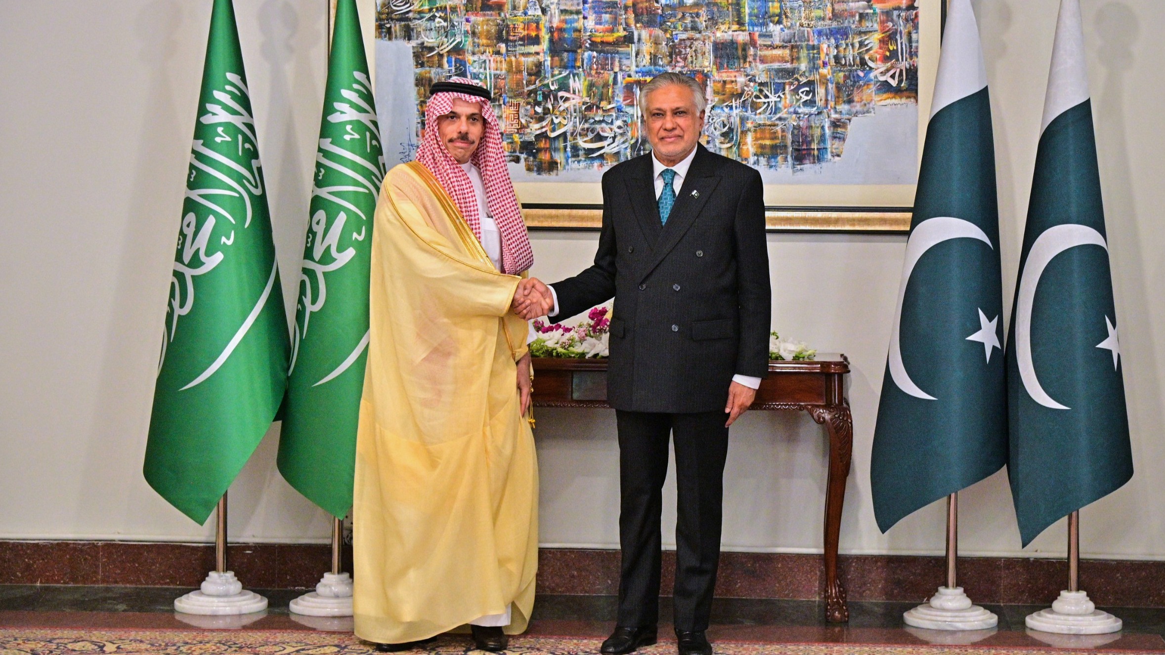 Saudi Arabia's Foreign Minister Prince Faisal bin Farhan Al-Saud shakes hand with his Pakistani counterpart Ishaq Dar, prior to their meeting in Islamabad, Pakistan.