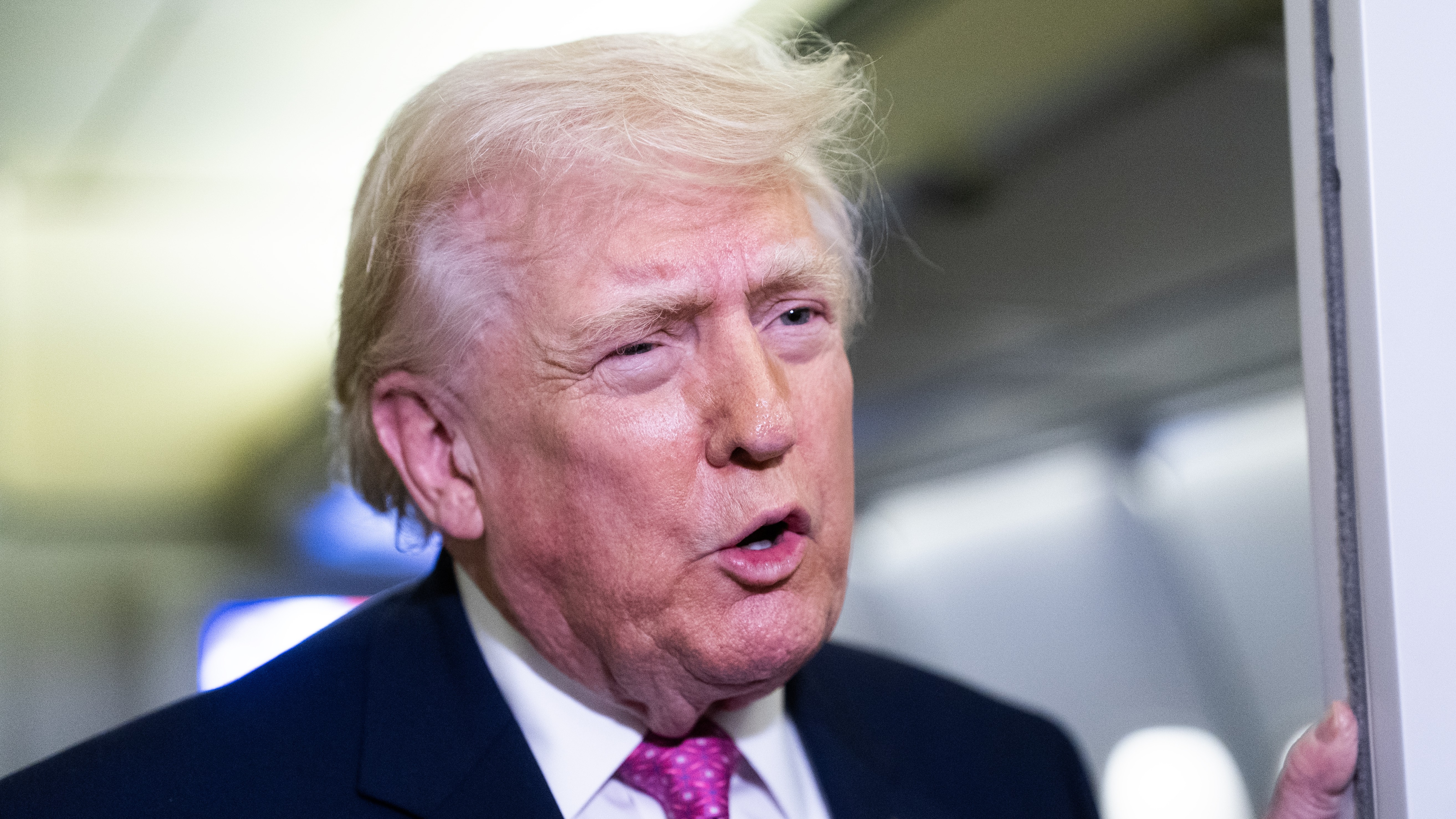 IN FLIGHT - MARCH 29: U.S. President Donald Trump speaks with members of the media onboard Air Force One on March 29, 2026 while en route to Joint Base Andrews, Maryland.