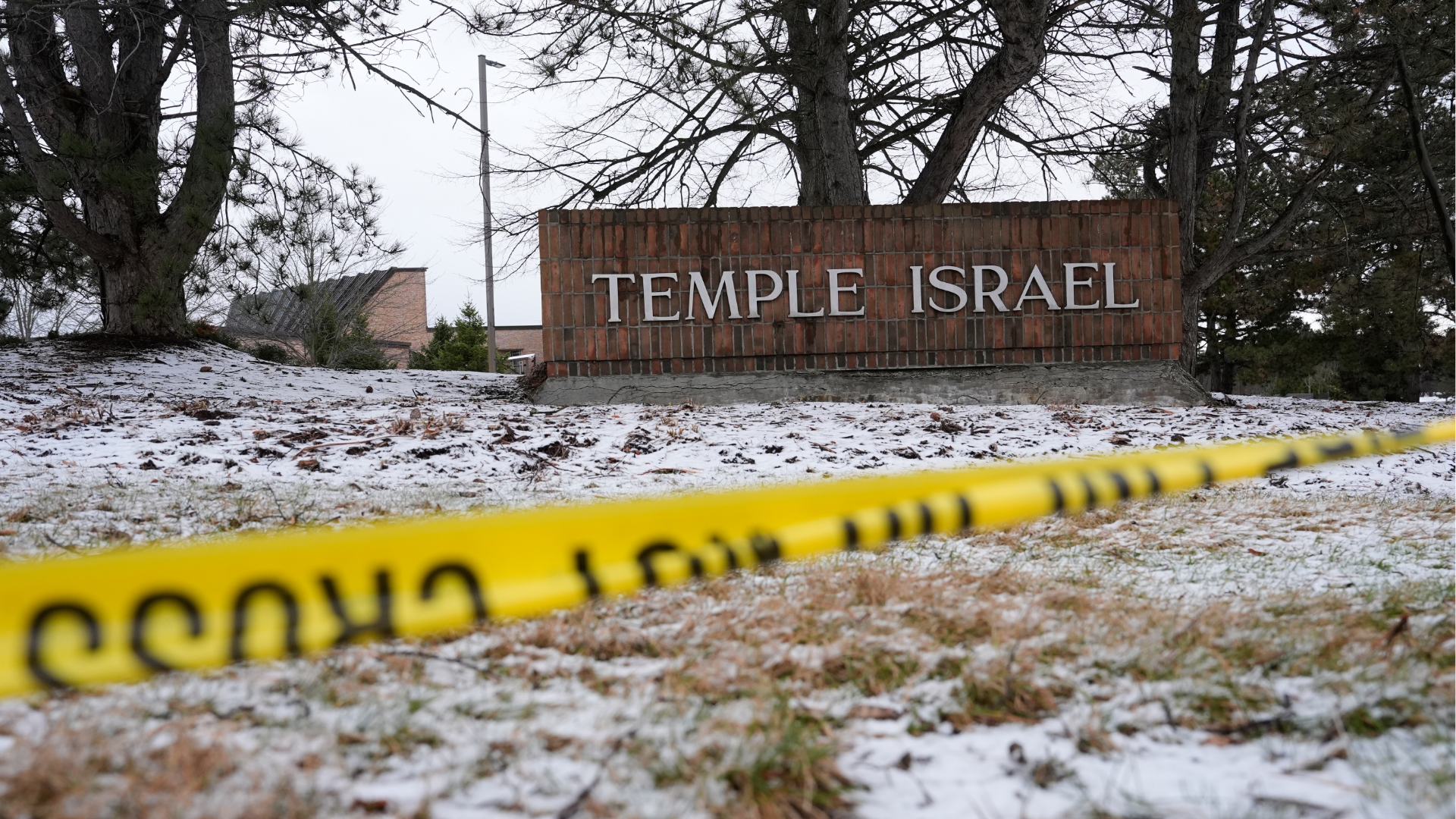 Police tape hangs outside the Temple Israel synagogue Friday, March 13, 2026, in West Bloomfield Township, Mich. 
