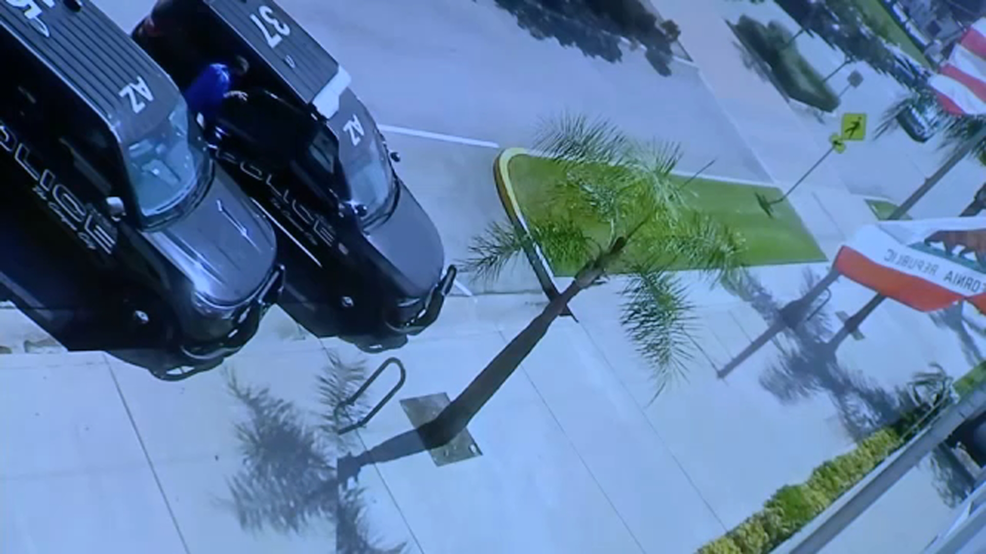 A still from surveillance video released by Azusa PD shows Eric Valencia getting into the back of a patrol car after being released from custody on Monday, March 23.