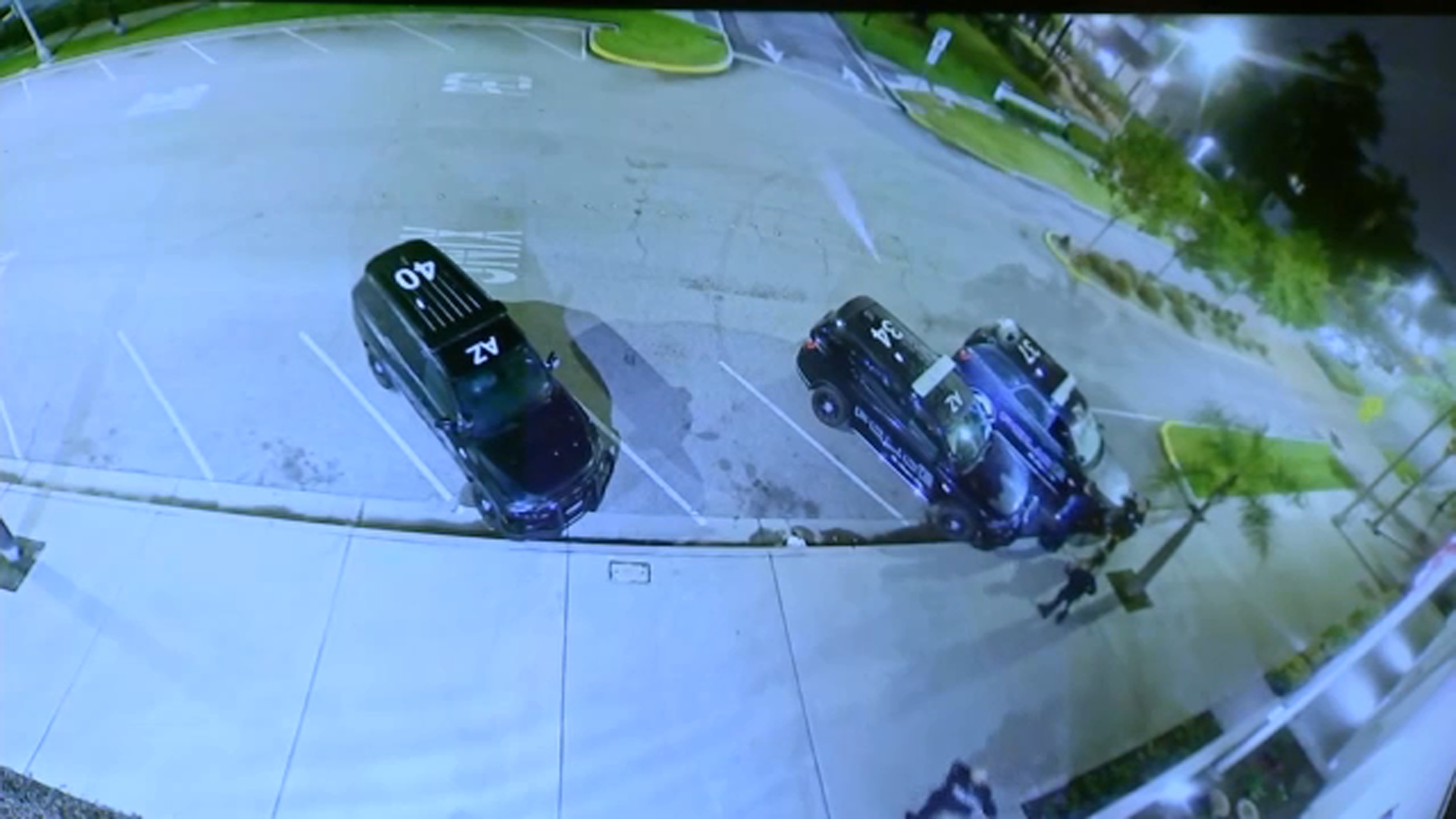 A still from surveillance video released by the Azusa Police Department shows officers discovering Eric Valencia in the back of a patrol car on Thursday, March 26.