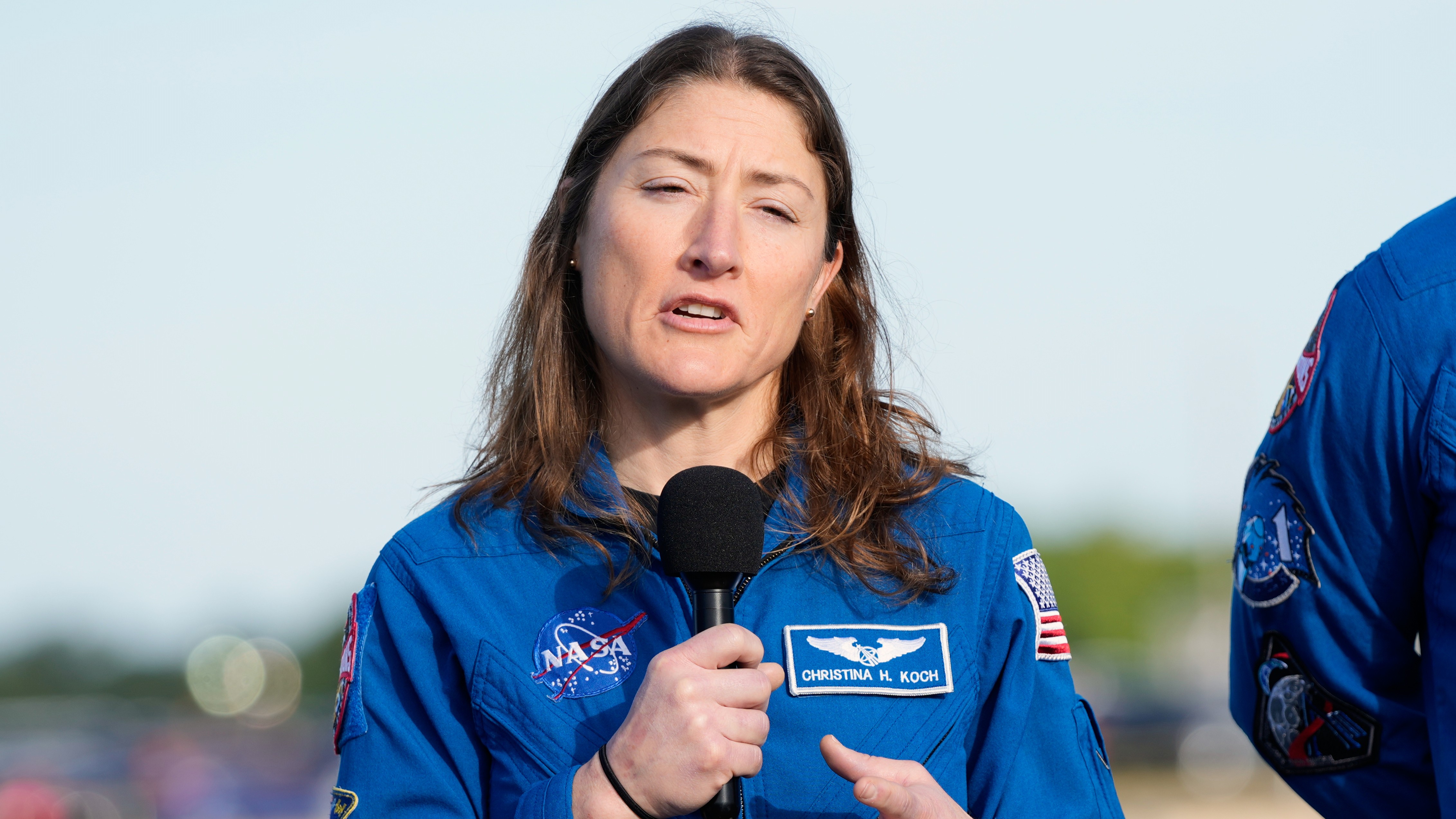 Mission specialist Christina Koch and a crew member on NASA's new moon rocket, Artemis 2, answer questions during a news conference at Kennedy Space Center on Jan. 17, 2026.