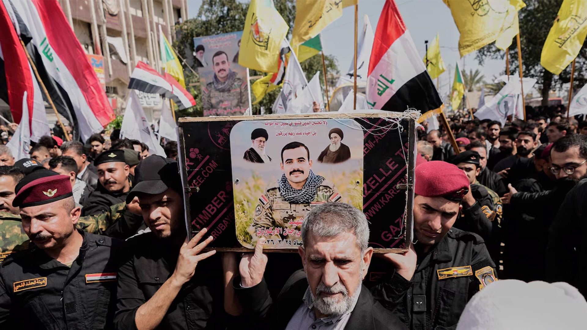 Members from the Popular Mobilization Forces attend a funeral of their colleague in Sadr city in Baghdad, on March 28, 2026.