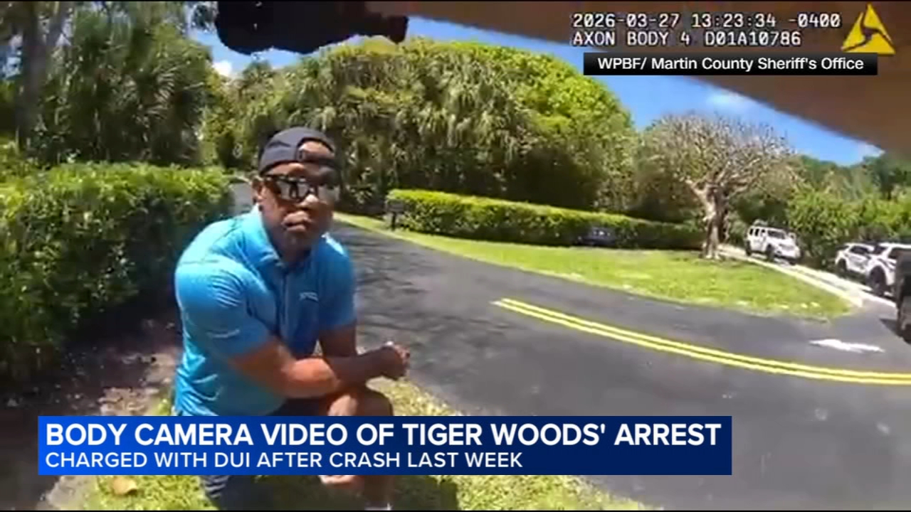 Bodycam shows a stunned Tiger Woods handcuffed after a Florida rollover crash
      