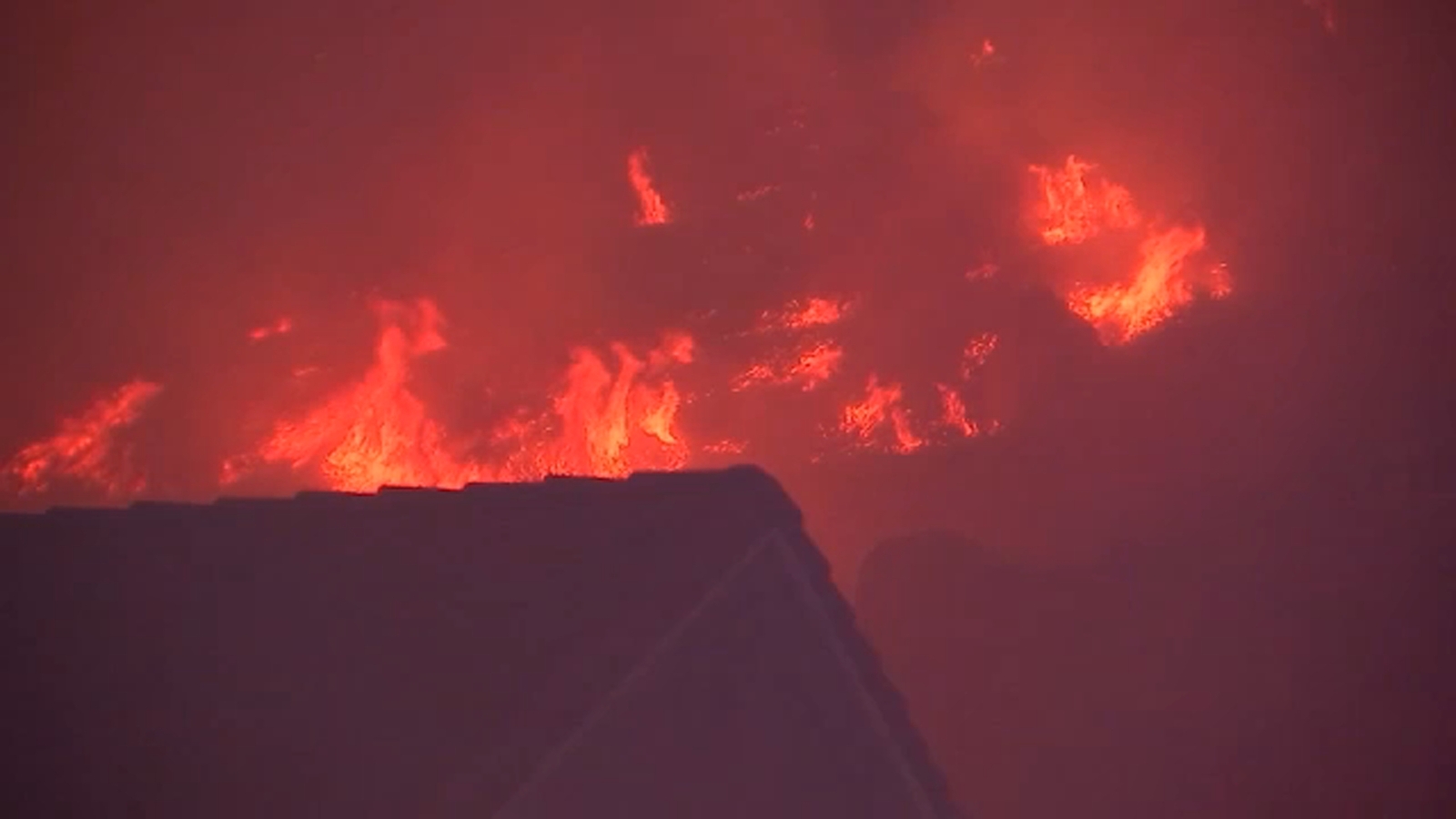 Bushfire burns at least 6 acres in Moreno Valley amid Santa Ana winds.