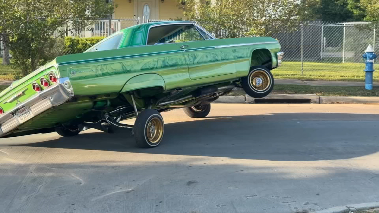 Custom lowriders cruising in 2026 Art Car Parade