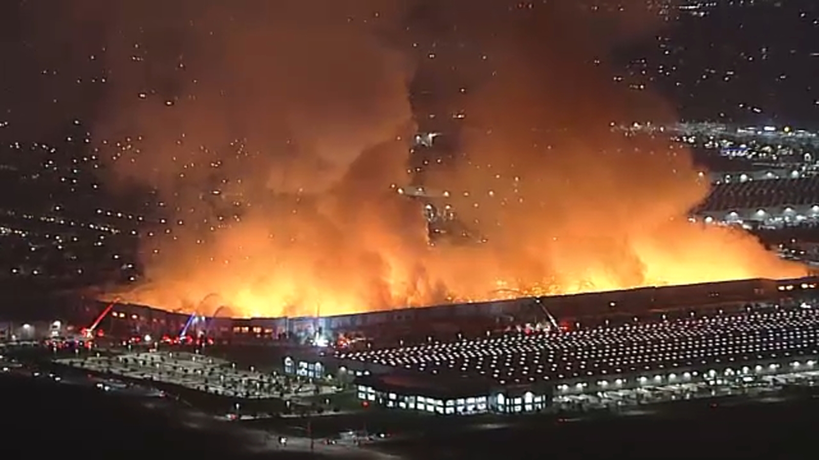 Arson suspect detained after massive fire tears through warehouse in Ontario