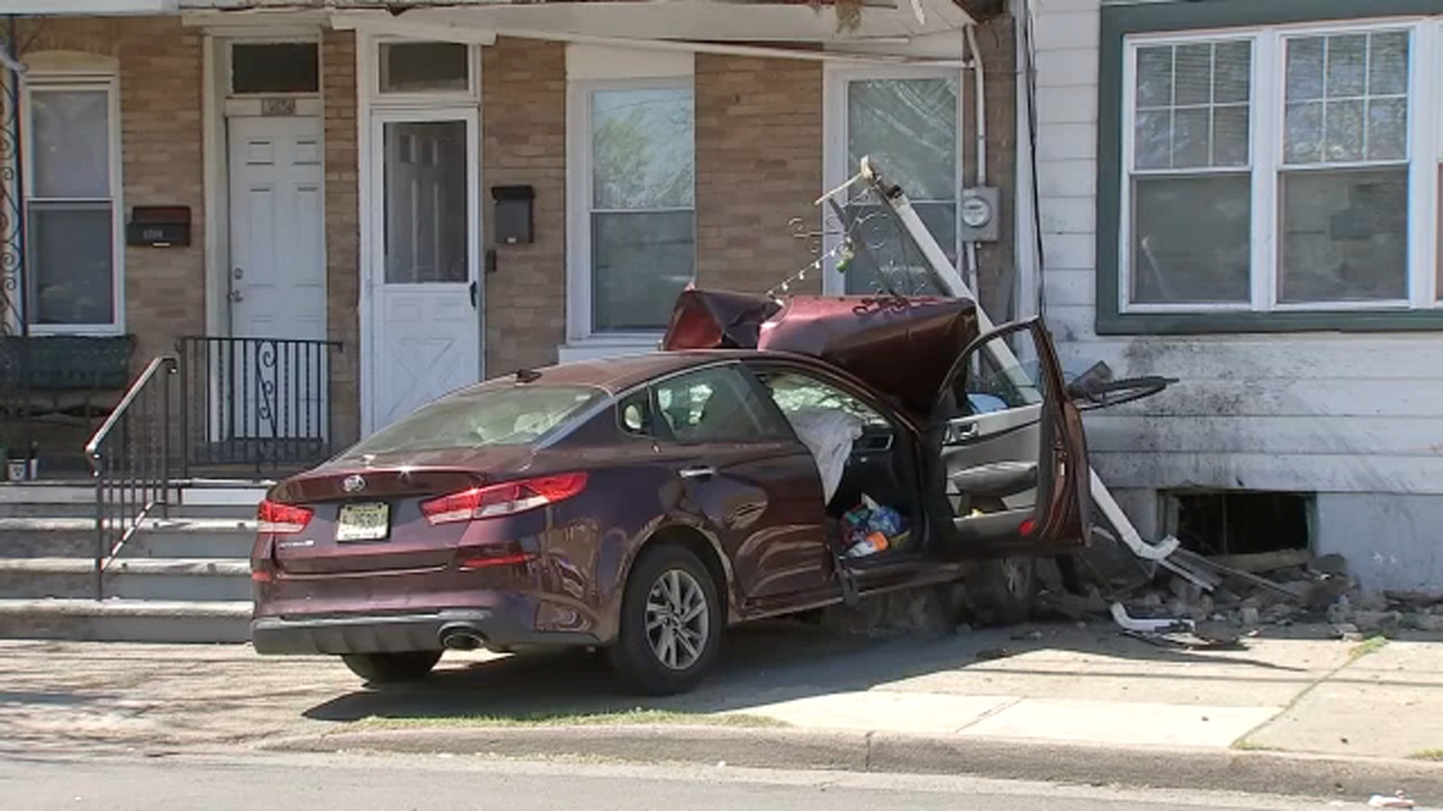 Car heavily damaged after slamming into Trenton, New Jersey home