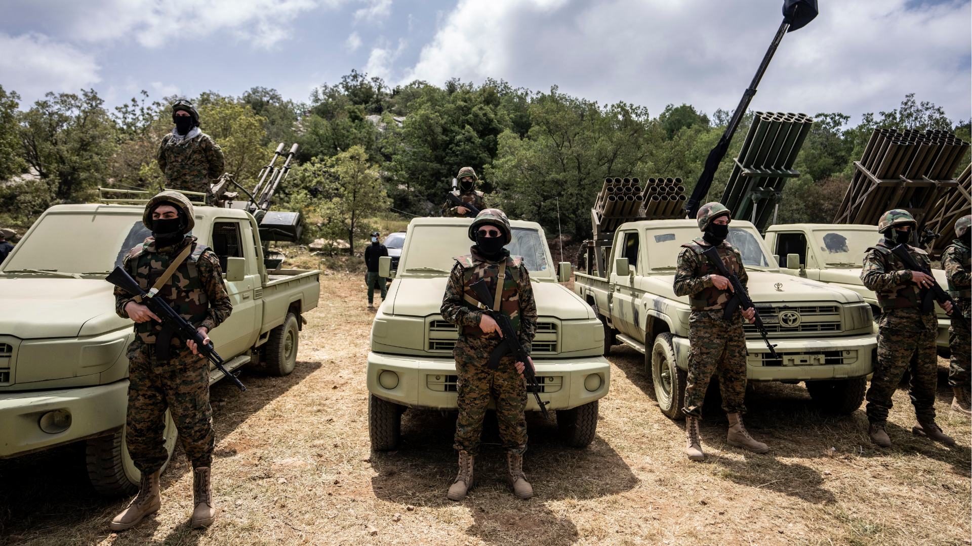 FILE - Fighters from the Lebanese militant group Hezbollah carry out a training exercise in Aaramta village in the Jezzine District, southern Lebanon, May 21, 2023.