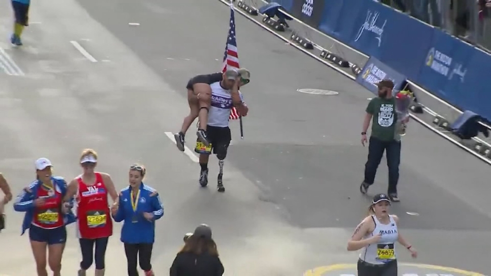 Wounded veteran carries Boston Marathon contestant across finish line