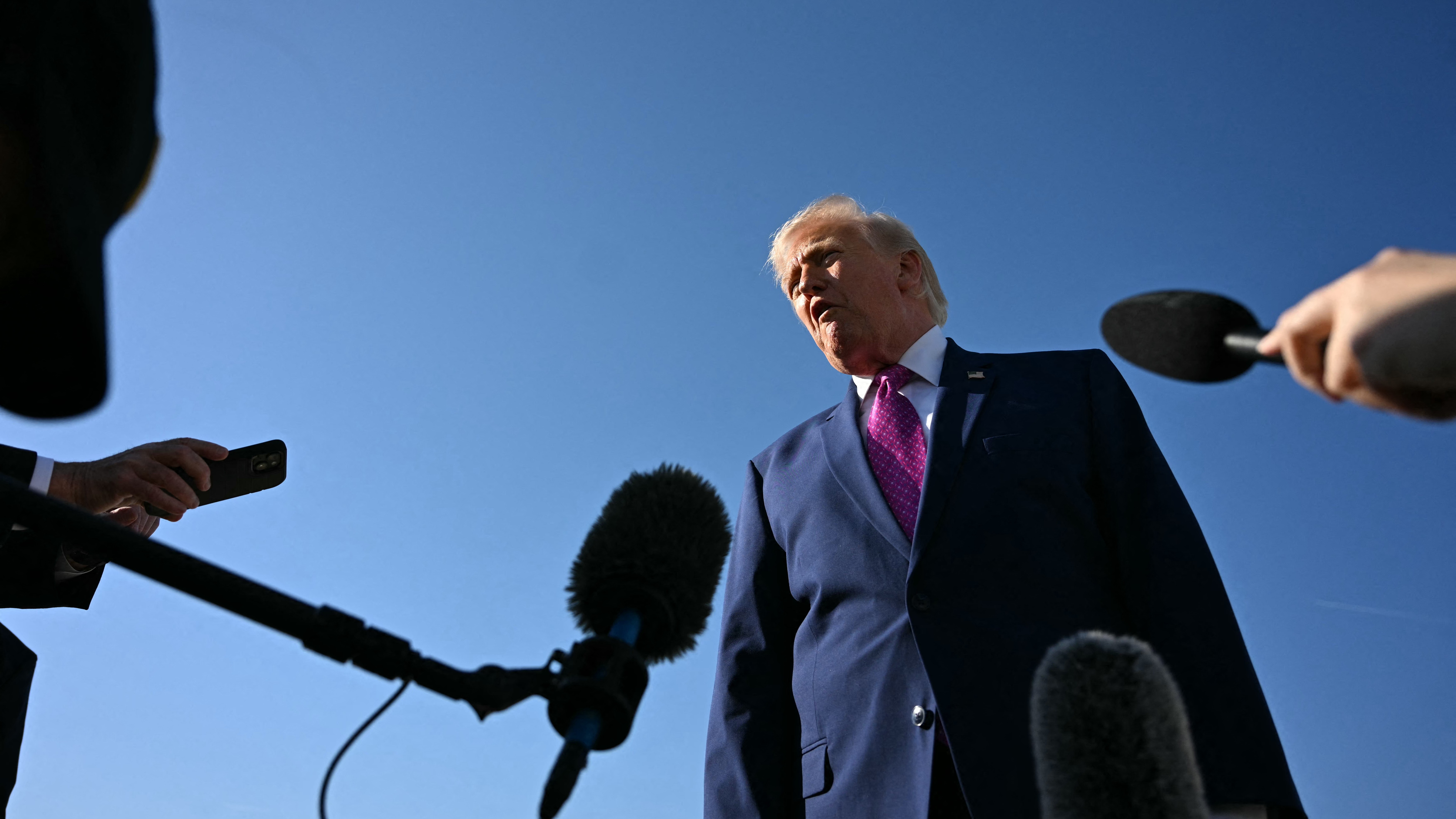 President Donald Trump speaks to the media, before boarding Air Force One on his way to Virginia, at Joint Base Andrews in Maryland, April 10, 2026.