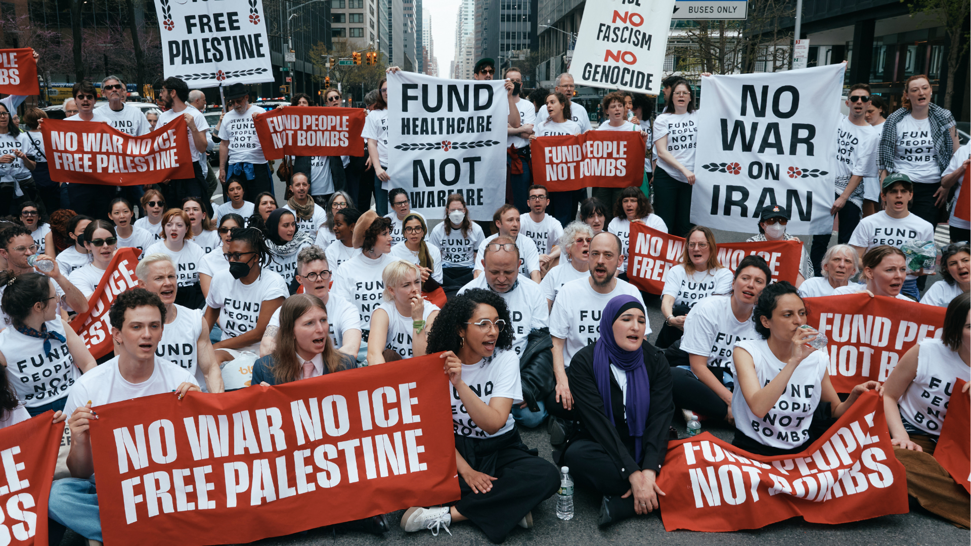 Chelsea Manning, bottom second left, and protesters with Jewish Voice for Peace block traffic during a demonstration, Monday, April 13, 2026, in New York.
