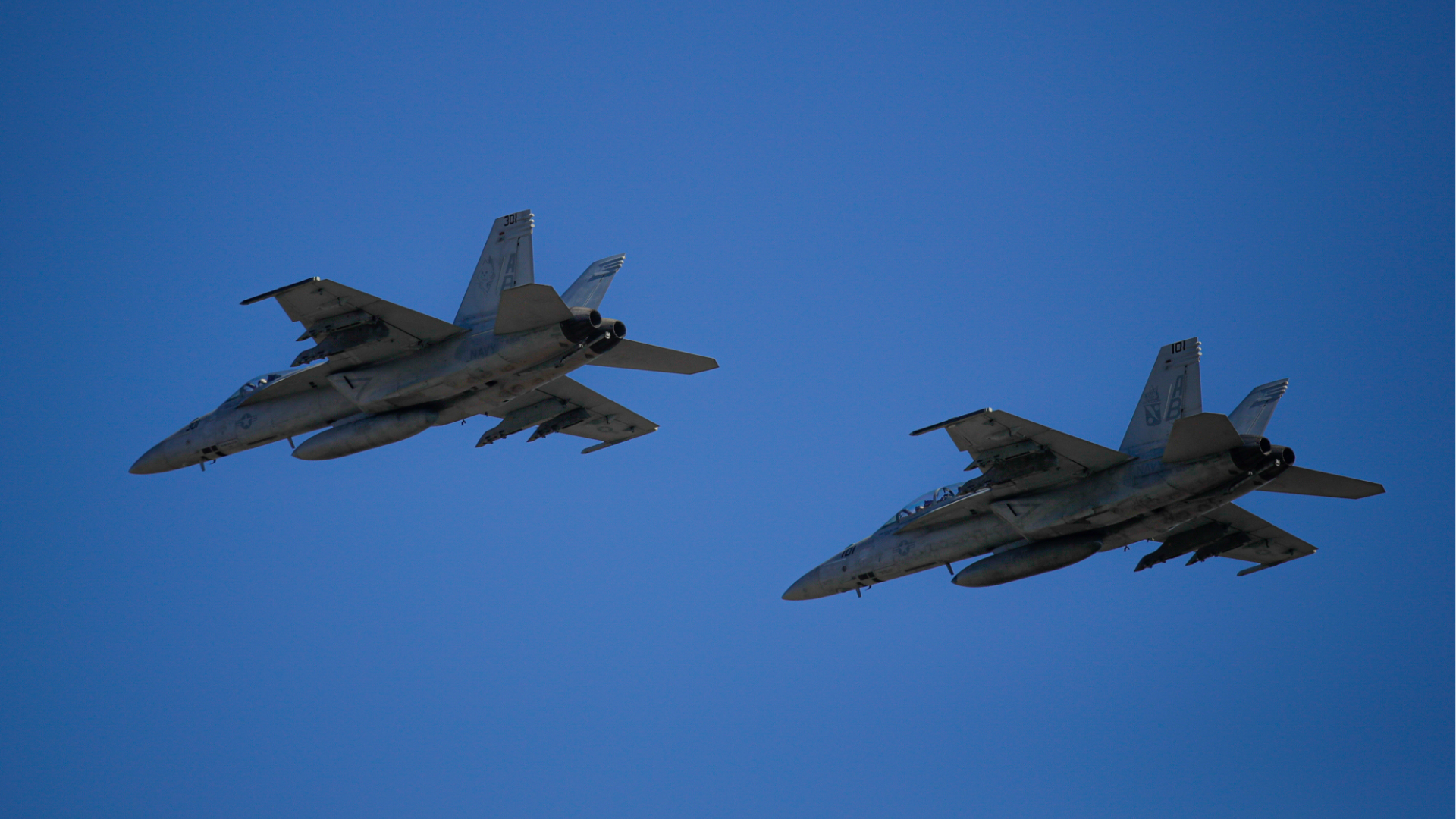 FILE - U.S. Navy fighter jets fly by at the Mihail Kogalniceanu airbase, near the Black Sea port city of Constanta, eastern Romania, Friday, Feb. 11, 2022.