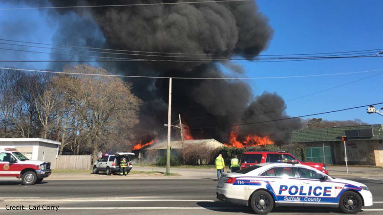 Firefighters battle lumber yard fire in Mastic Beach