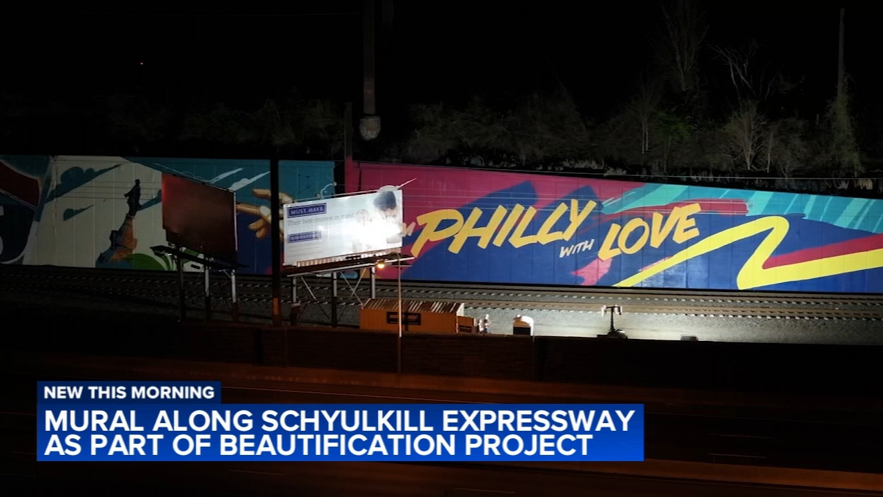 Work on mural along I-76 as part of beautification project
