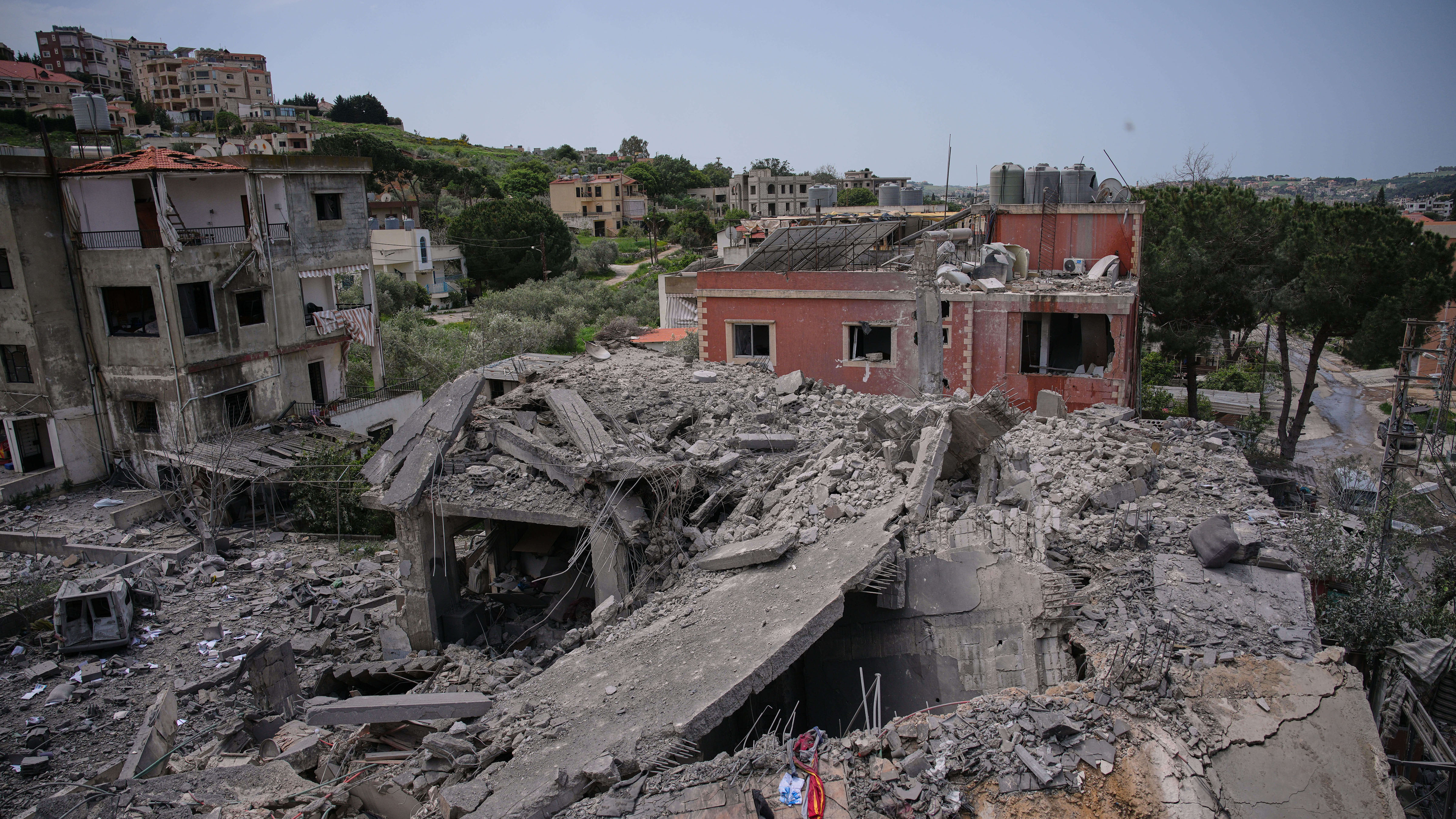 Debris of a destroyed building are scattered after an Israeli airstrike in Kfar Roumman, southern Lebanon, Friday, April 17, 2026.