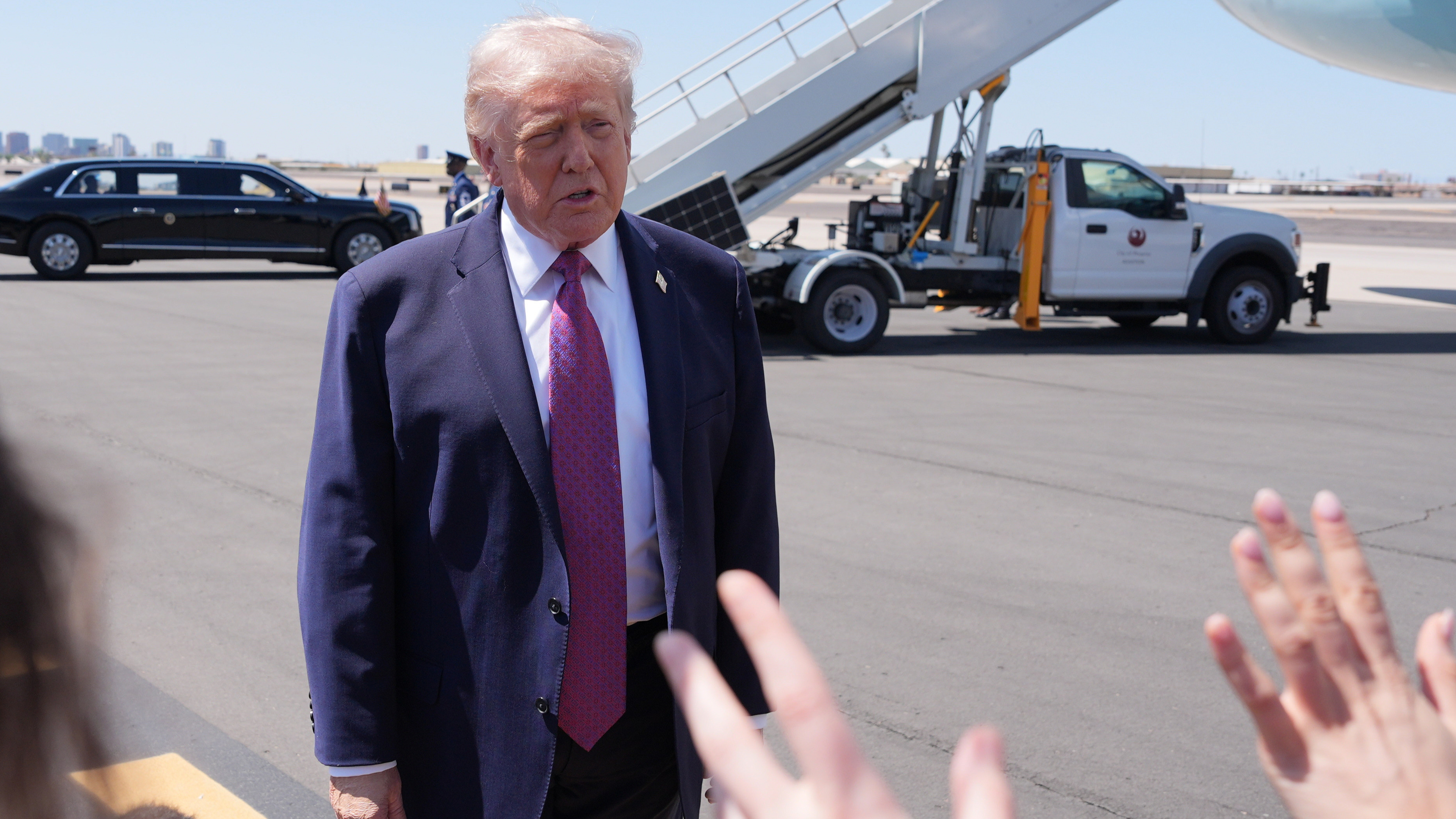President Donald Trump talks with reporters after arriving on Air Force One, Friday, April 17, 2026, at Phoenix Sky Harbor International Airport in Phoenix.