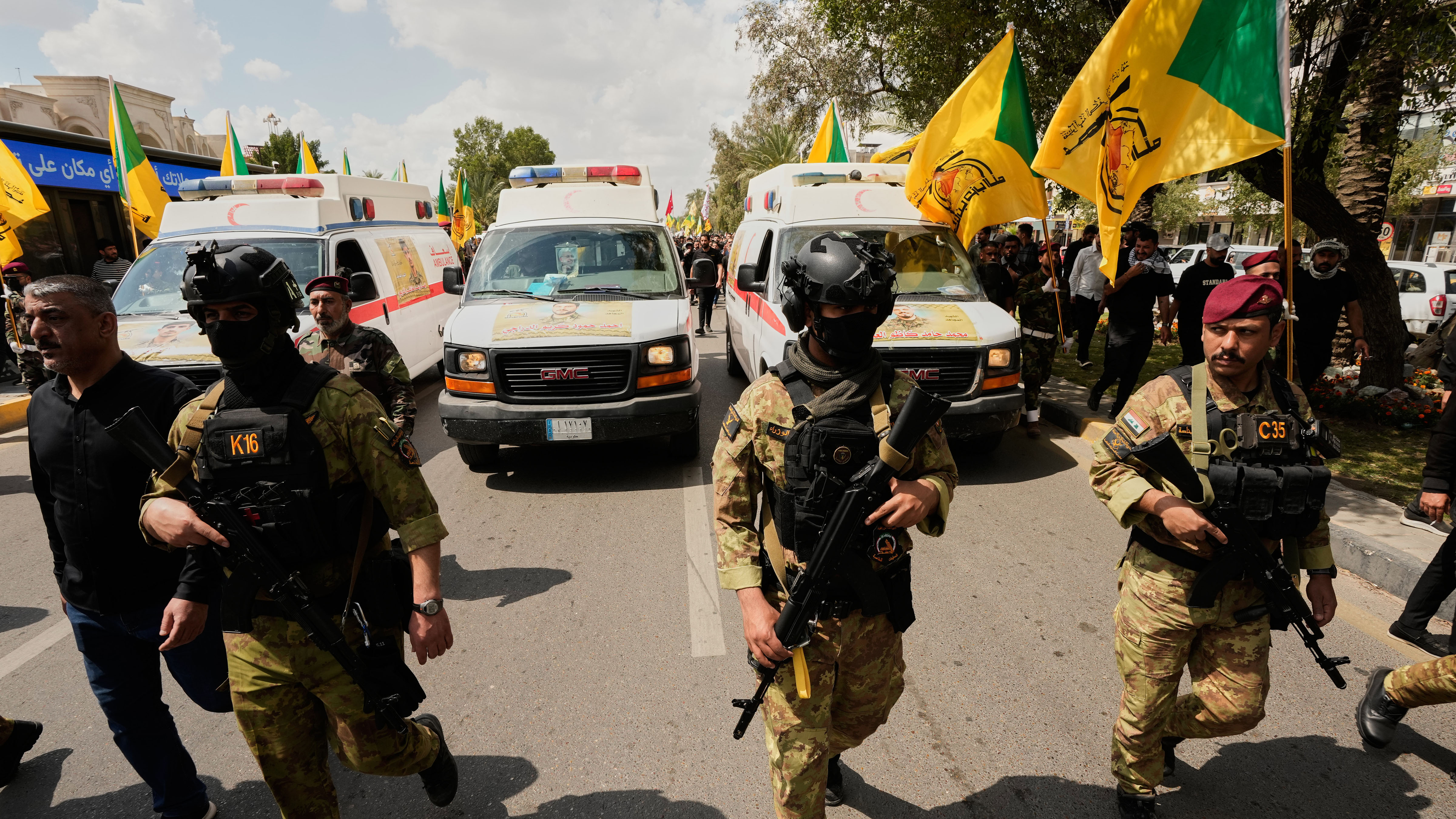 Members of an Iraqi Shiite militant group attend a funeral of a fighter with the Kataib Hezbollah, who was killed in a U.S. airstrike, Wednesday, April 8, 2026.