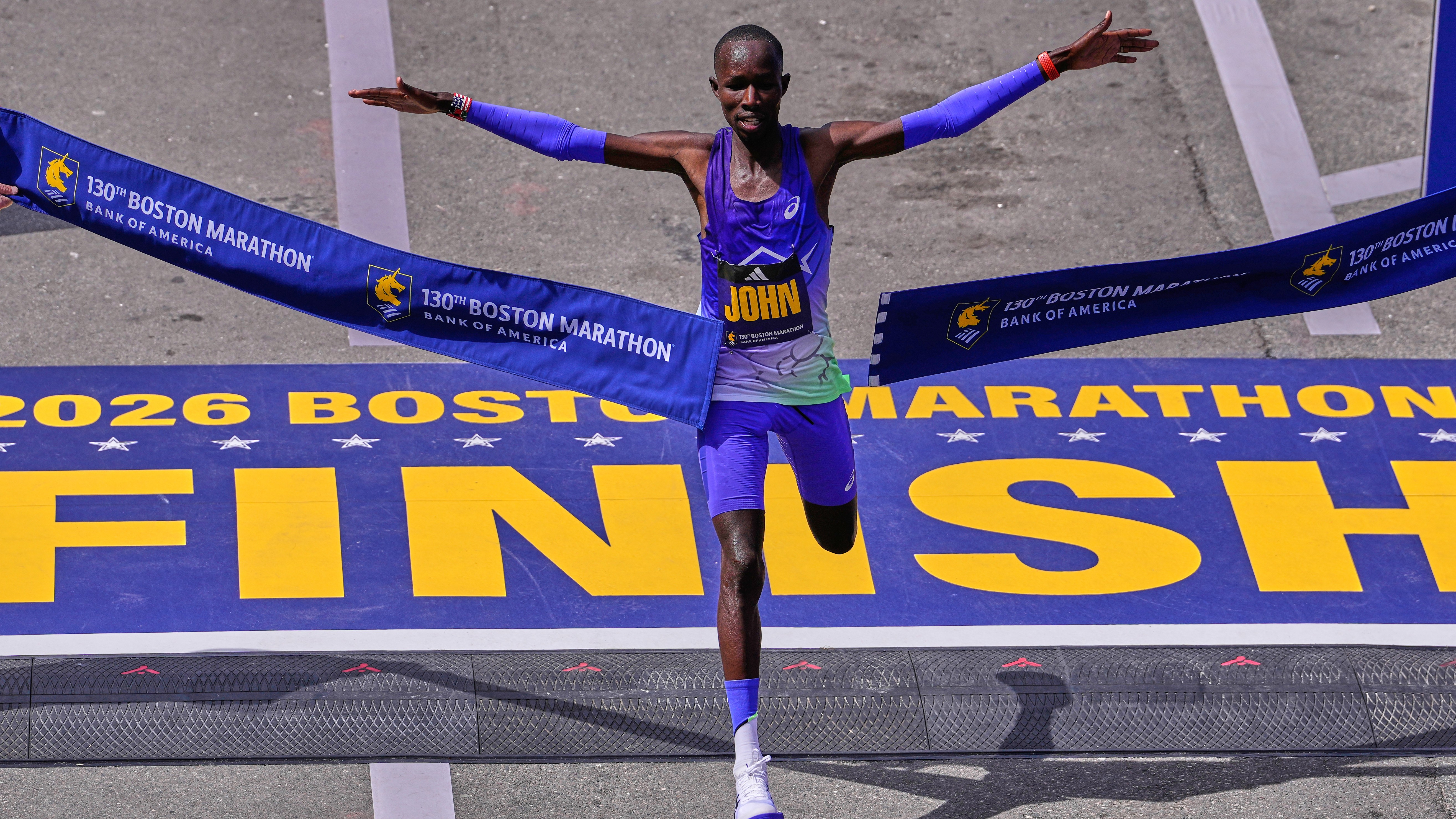 John Korir, of Kenya, breaks the tape to win the Boston Marathon, Monday, April 20, 2026, in Boston. (AP Photo/Charles Krupa)