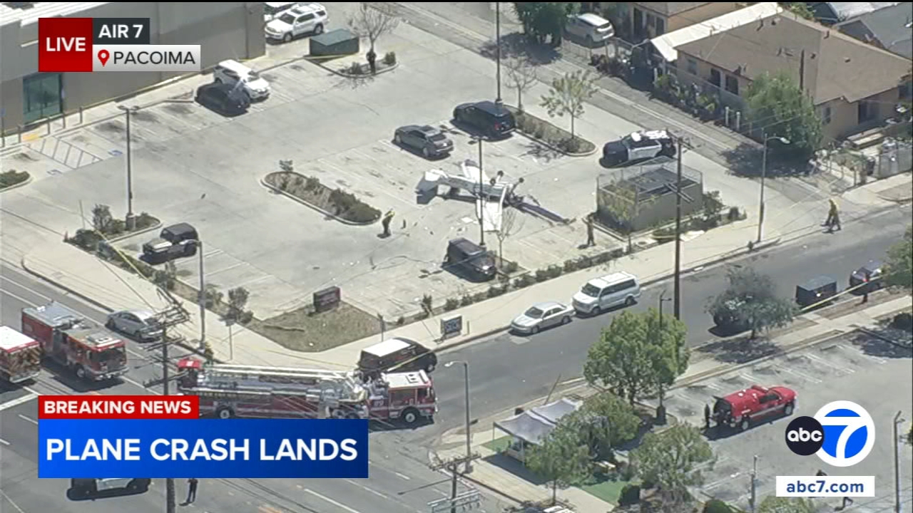 Small plane snaps power pole, overturns in crash in Pacoima parking lot; pilot hospitalized