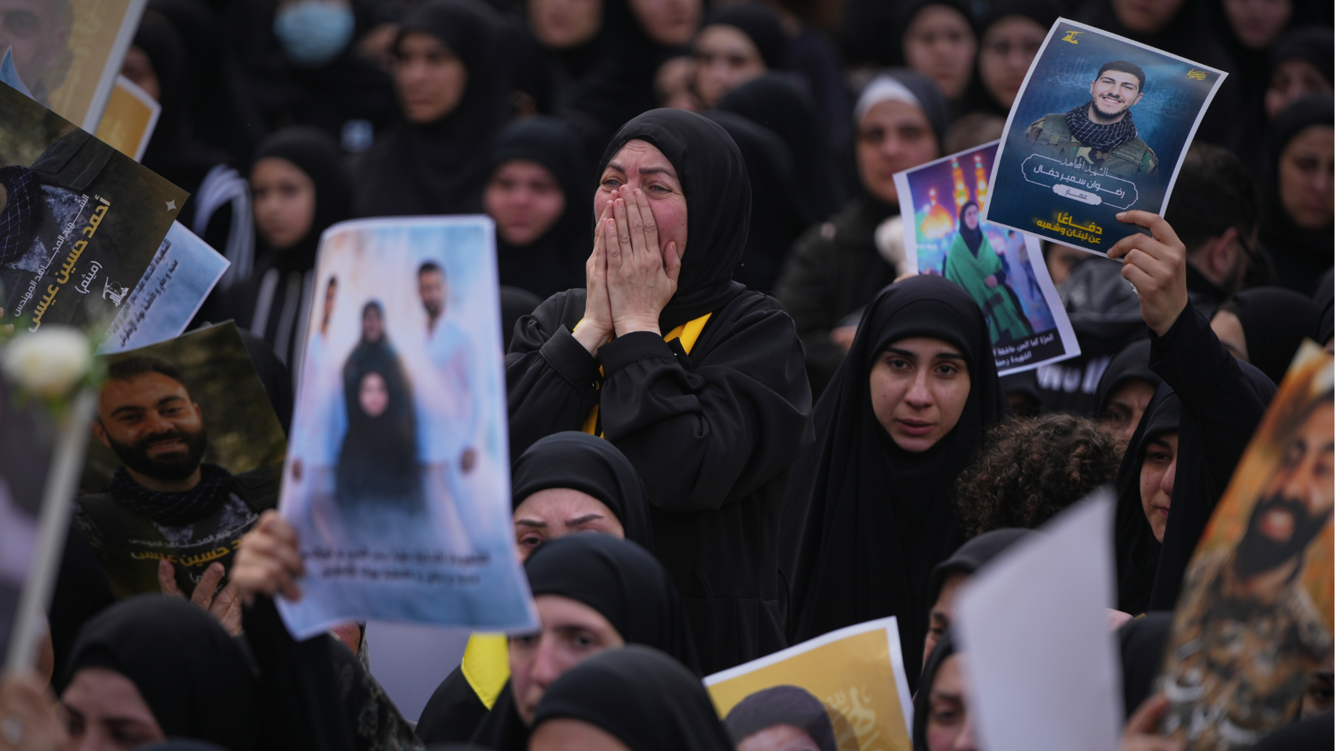 Women mourn during a mass funeral procession for Hezbollah fighters killed before the ceasefire in the war with Israel in the village of Kfar Sir, Lebanon, Tuesday, April 21, 2026.