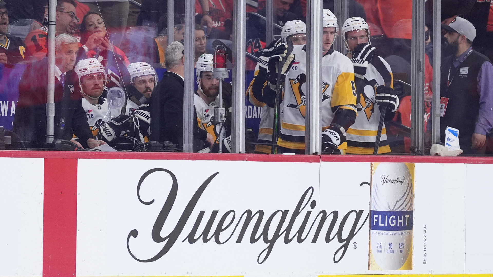 Penguins' players watch from the penalty box during the second period of Game 3 against the Flyers in the first round of the NHL Stanley Cup hockey playoffs, April 22, 2026.