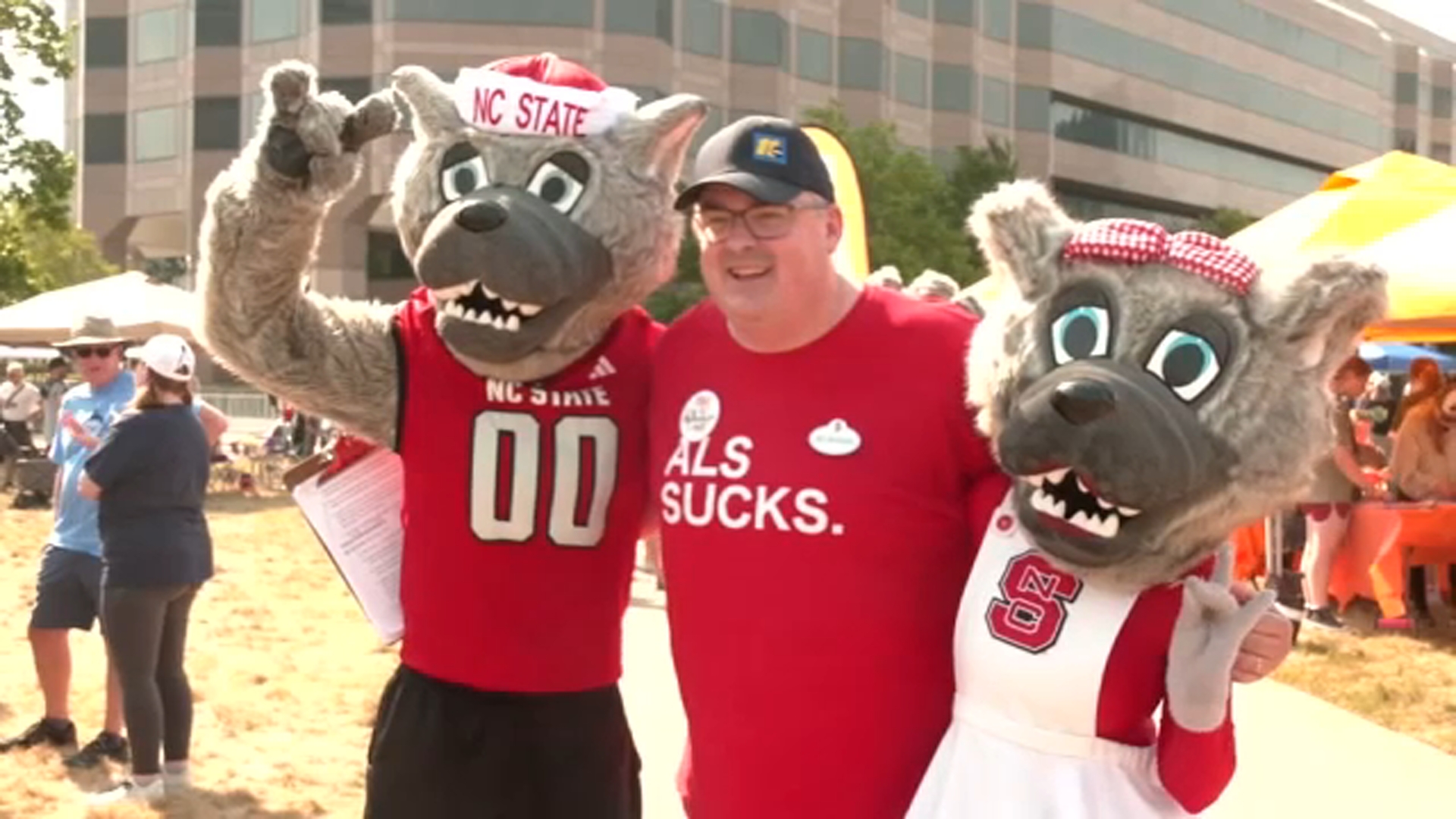 ABC11 Meteorologist Don Schwenneker with NC State mascots Mr. Wuf and Ms. Wuf at the 2026 Triangle ALS Walk.