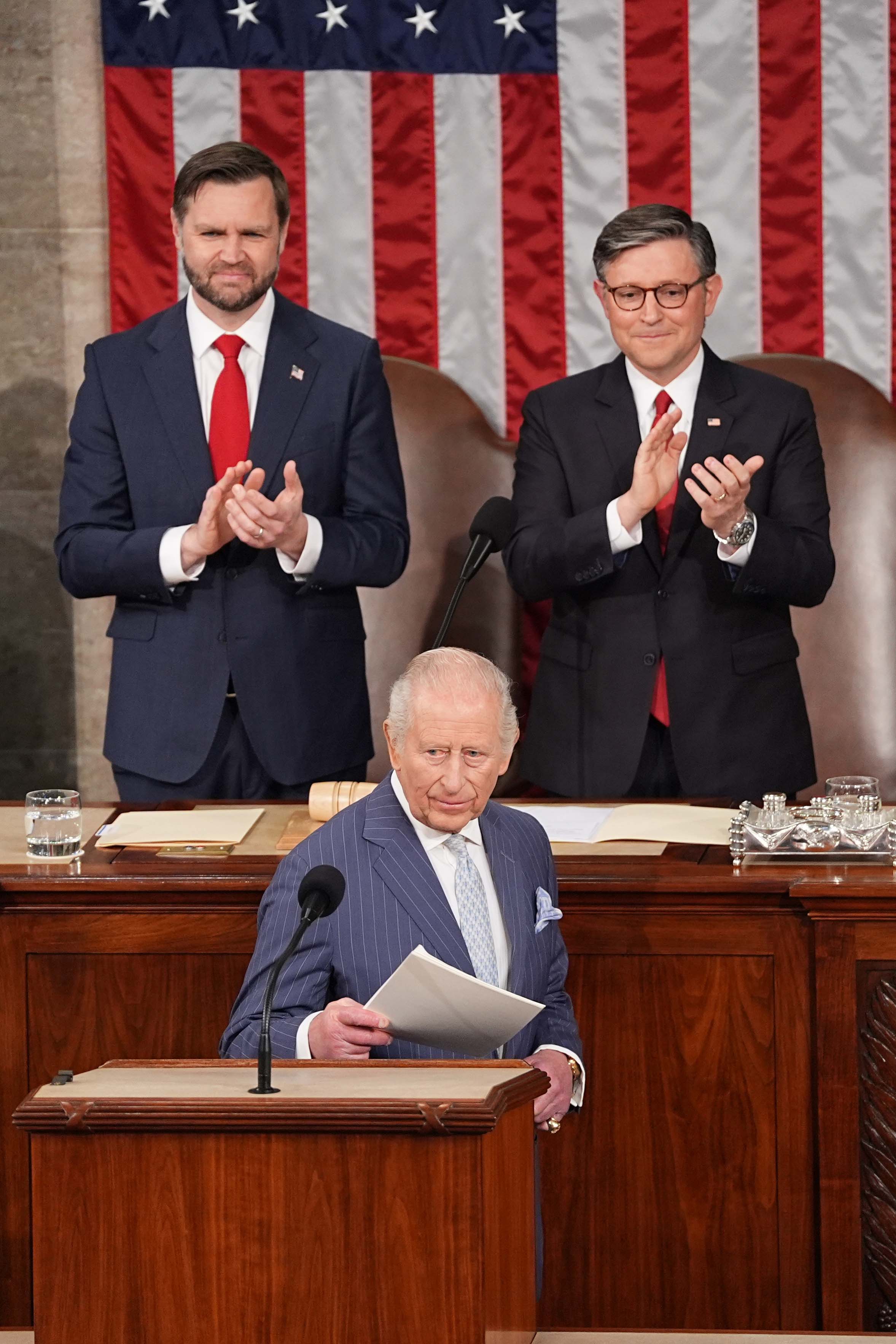 Britain's King Charles III is seen at a joint meeting of Congress at the U.S. Capitol, April 28, 2026, in Washington, as VP JD Vance and House Speaker Mike Johnson applaud.