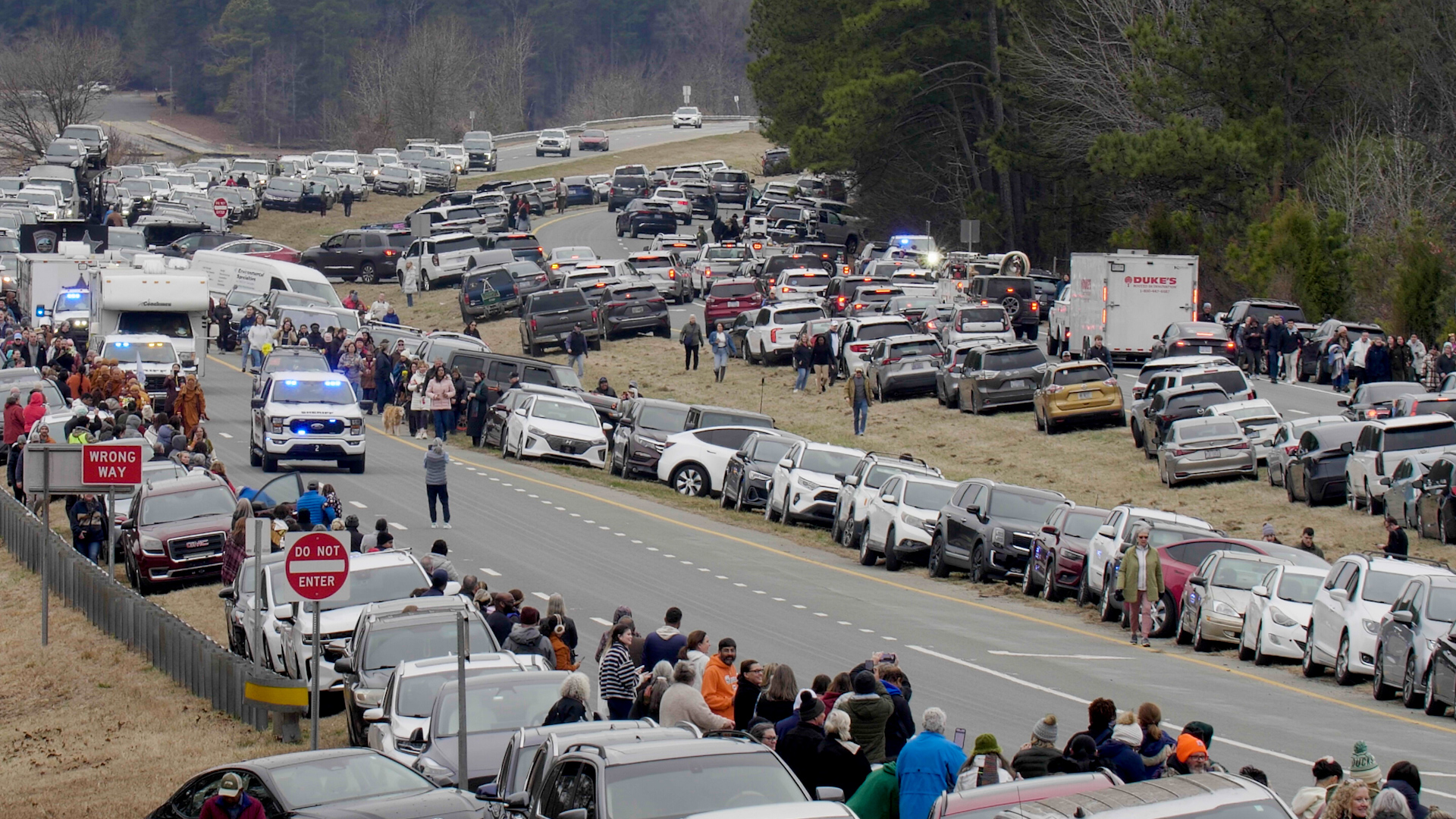 A rare sight on a North Carolina highway, crowds and parked cars line both sides of the road as the Walk for Peace passes through.